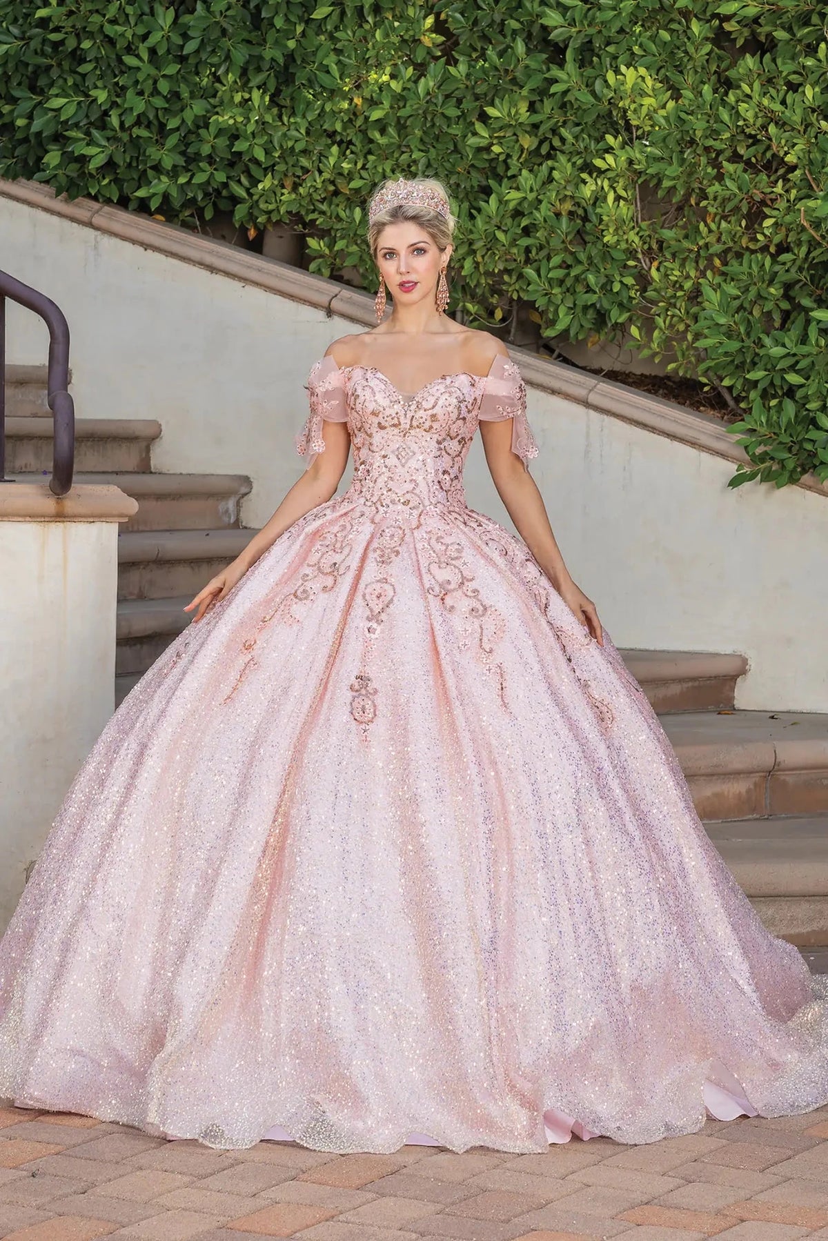 Front view of a Rose Gold quinceañera gown with cap sleeves and embroidered bodice