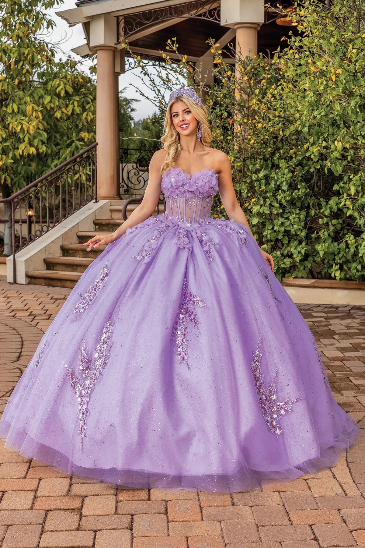 Full-length front view of a Lilac quinceañera gown with off-the-shoulder neckline and floral appliqués