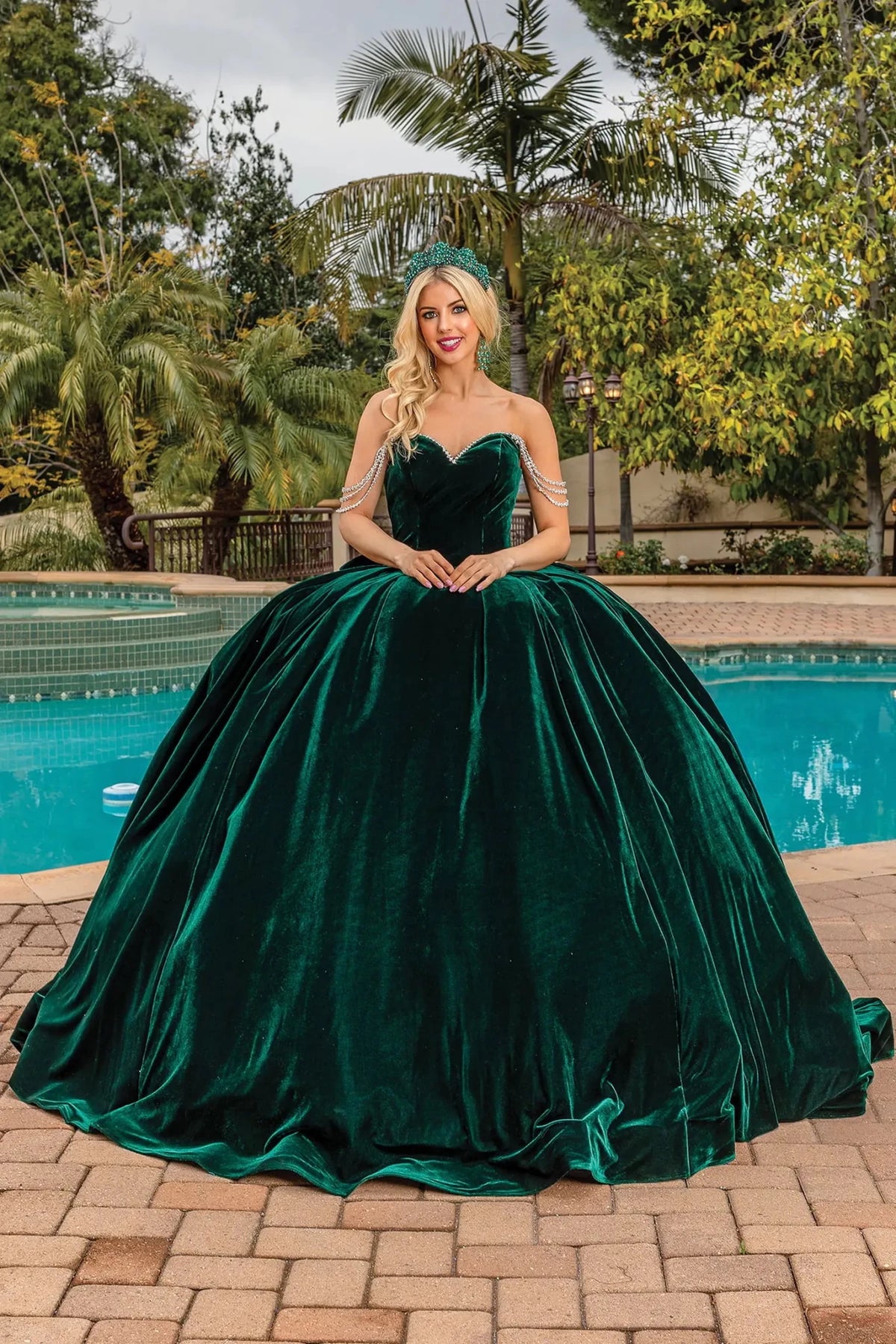 Full-length front view of a Hunter Green quinceañera gown with off-the-shoulder neckline and crystal accents