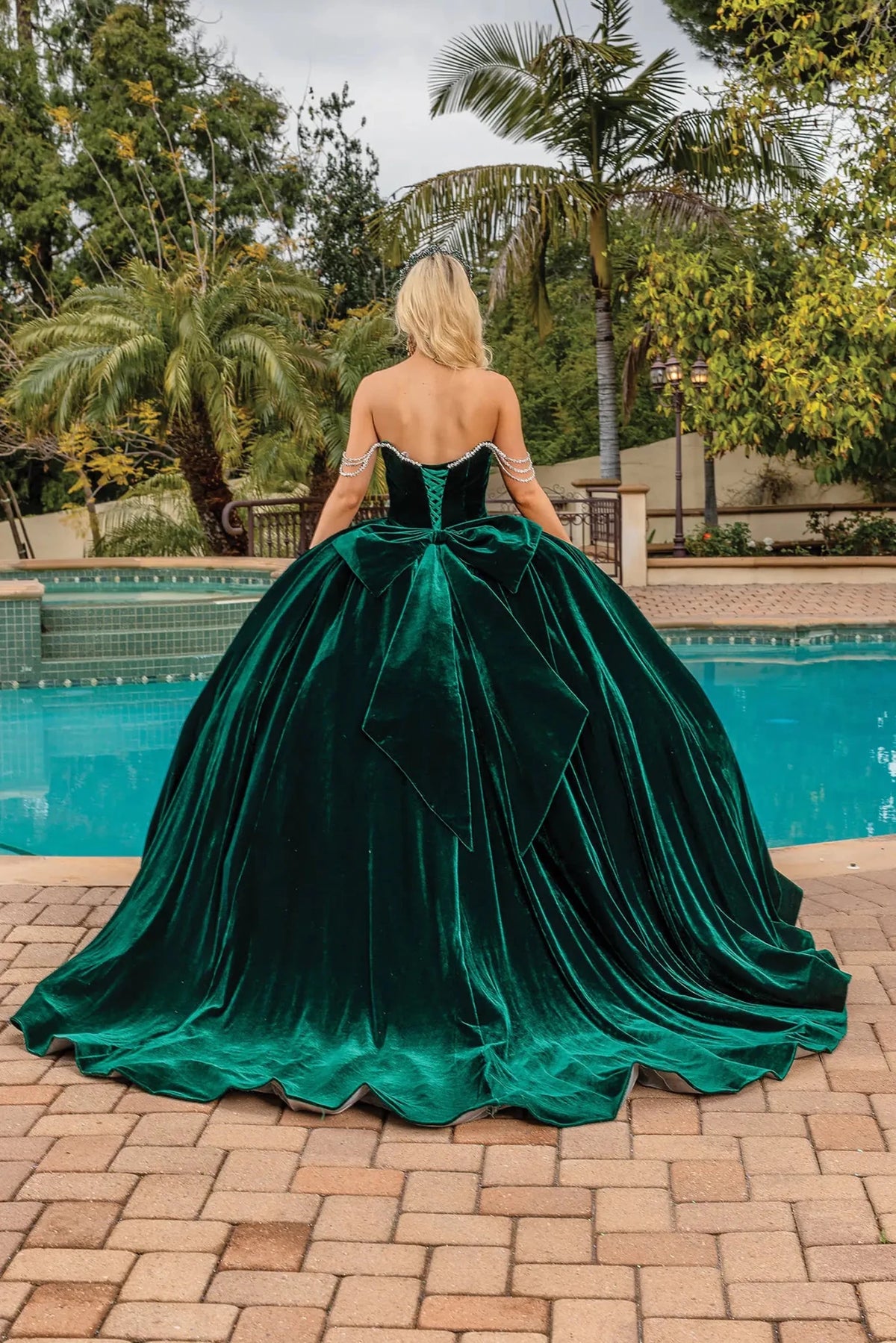 Back view of a Hunter Green quinceañera gown showing lace-up back and crystal accents