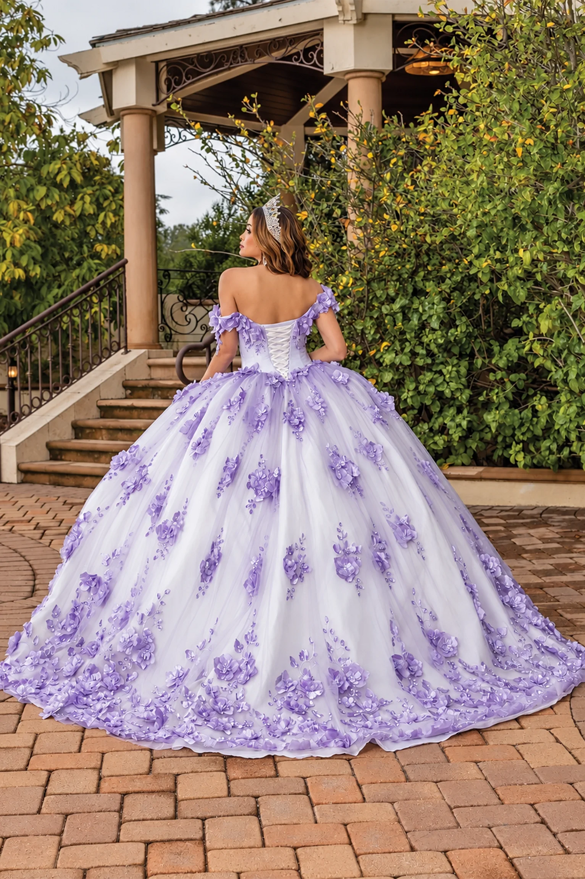 Back view of a Lilac/Off White quinceañera gown showing lace-up back and floral embroidery