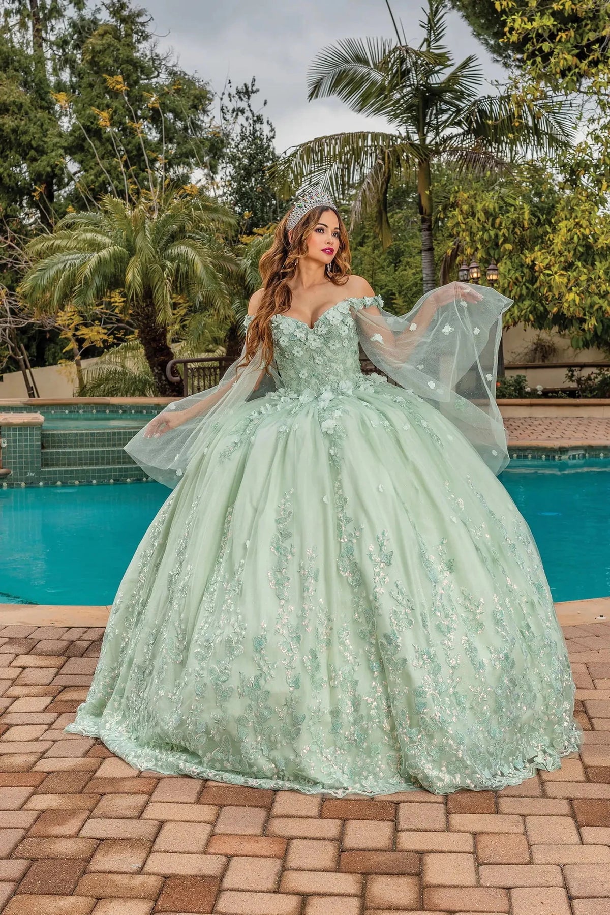 Front view of a Sage quinceañera gown with sweetheart neckline and floral embroidery