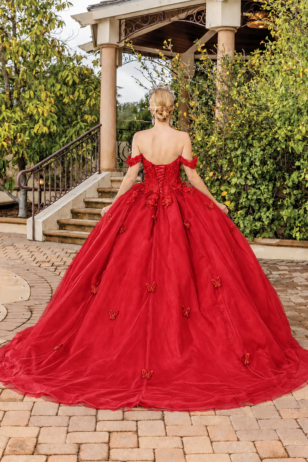 Red floral appliqué quinceanera dress, back view with lace-up closure