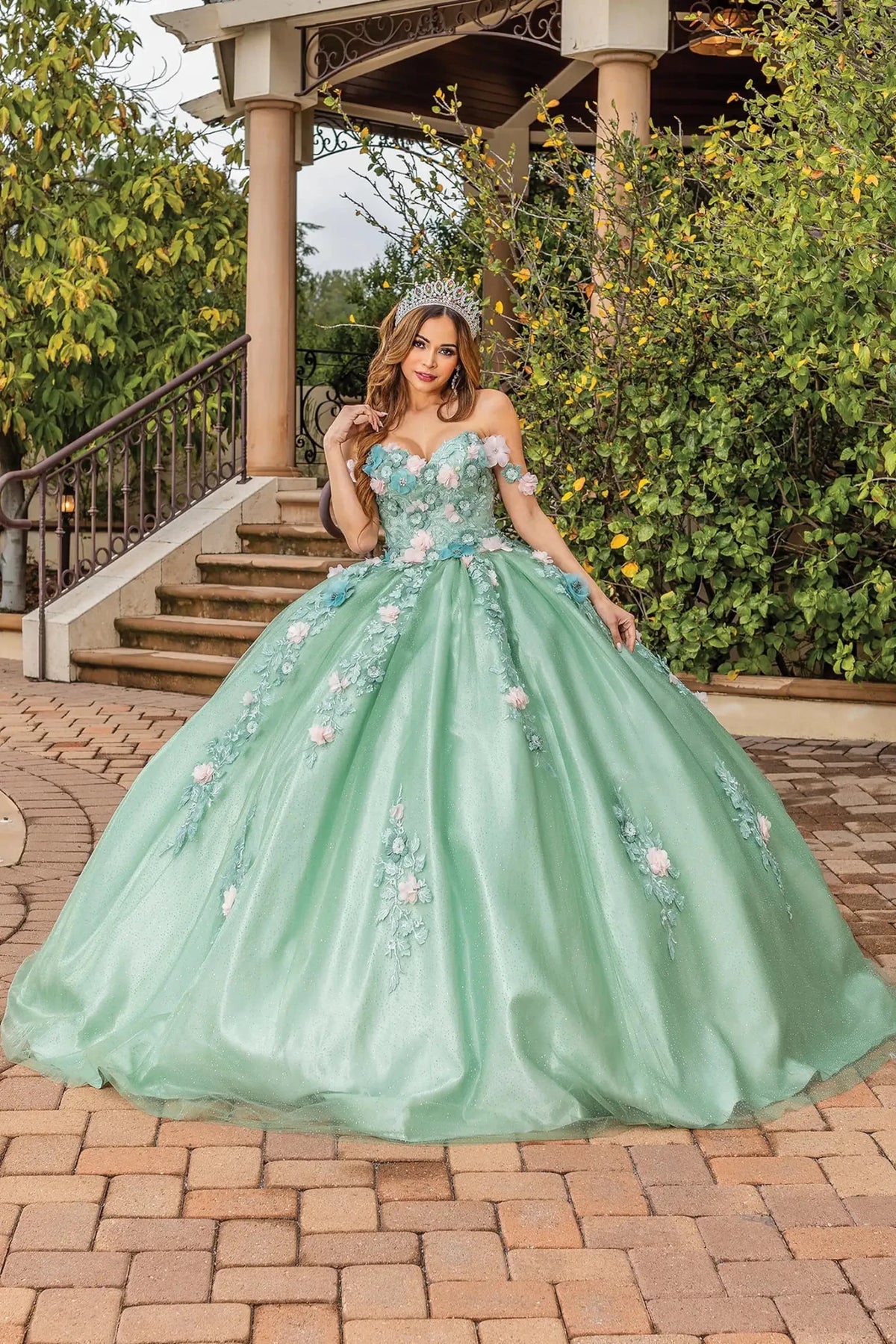 Front view of a Sage quinceañera gown with detachable sleeves and corset bodice