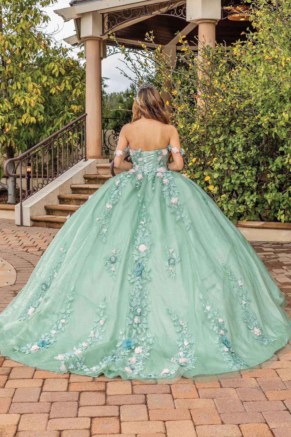 Back view of a Sage quinceañera gown showing lace-up back and detachable sleeves