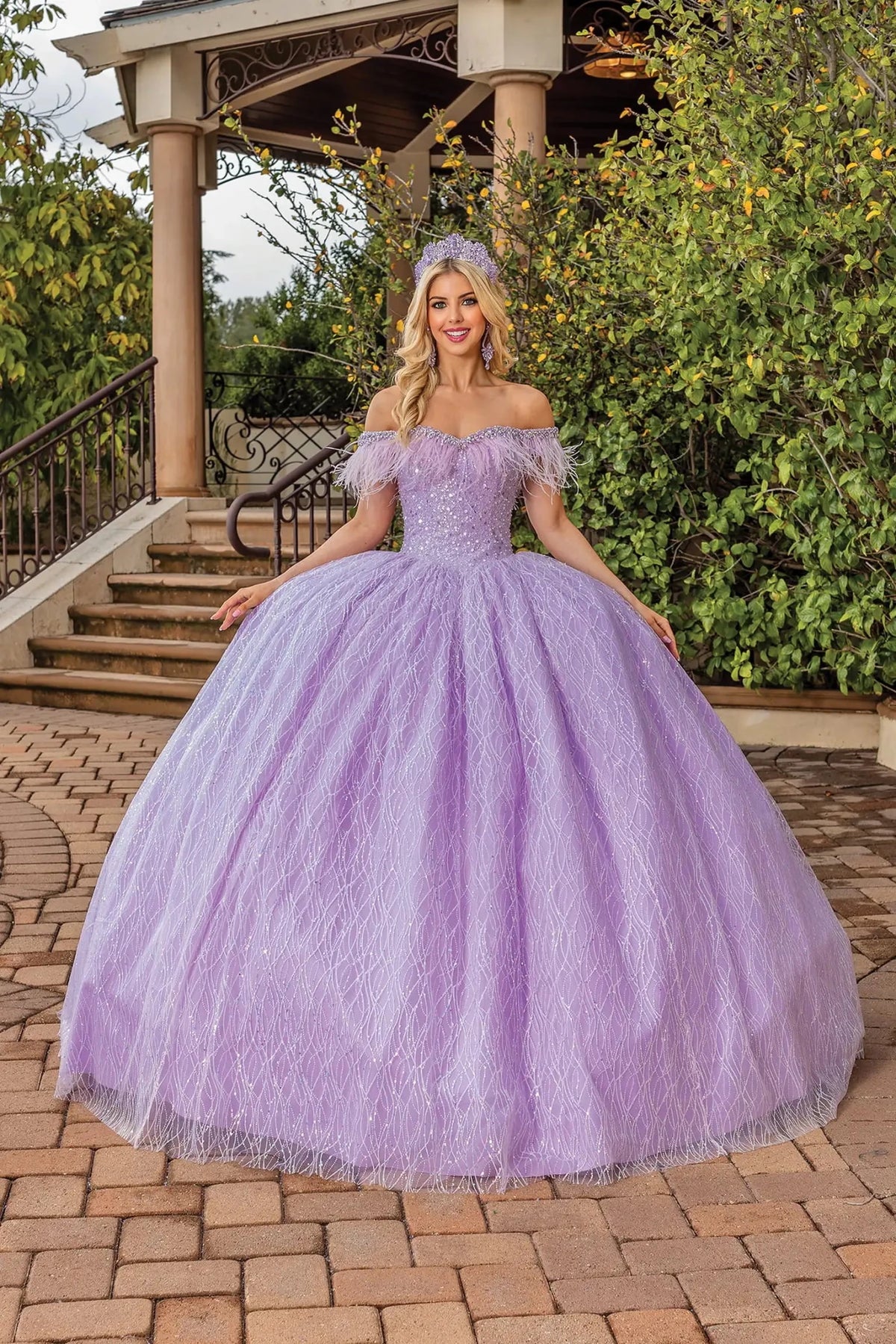 Front view of a Lilac quinceañera gown with off-the-shoulder neckline, beaded lace bodice, and glitter tulle skirt