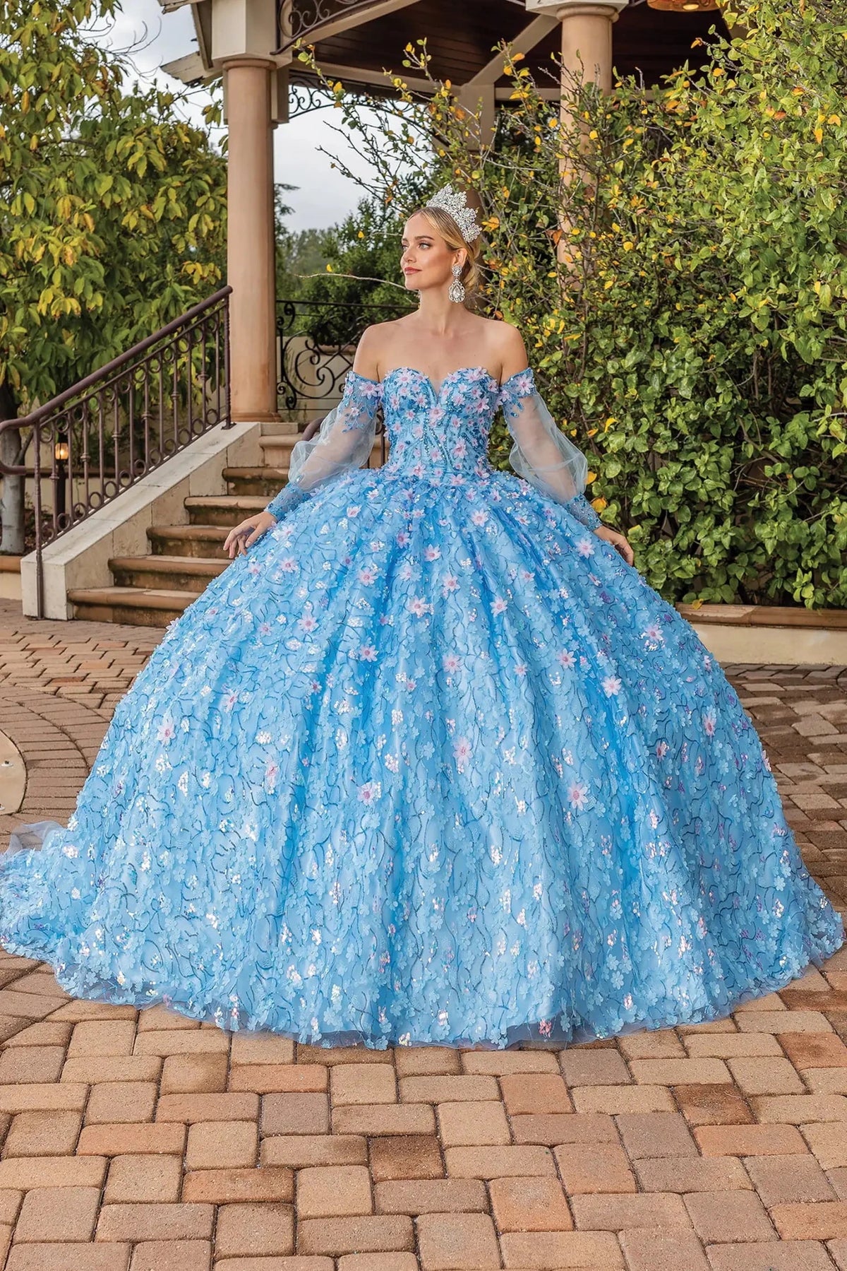 Front view of a Bahama Blue quinceañera gown with off-the-shoulder neckline, floral embroidery, and layered tulle skirt