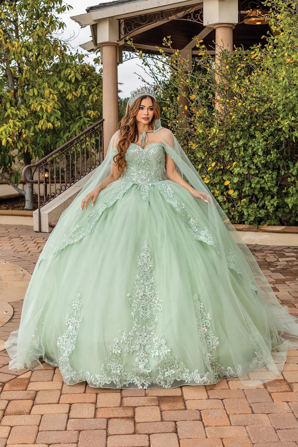Front view of a Sage quinceañera gown with sweetheart neckline, detachable sleeves, crystal accents, and embroidered tulle skirt