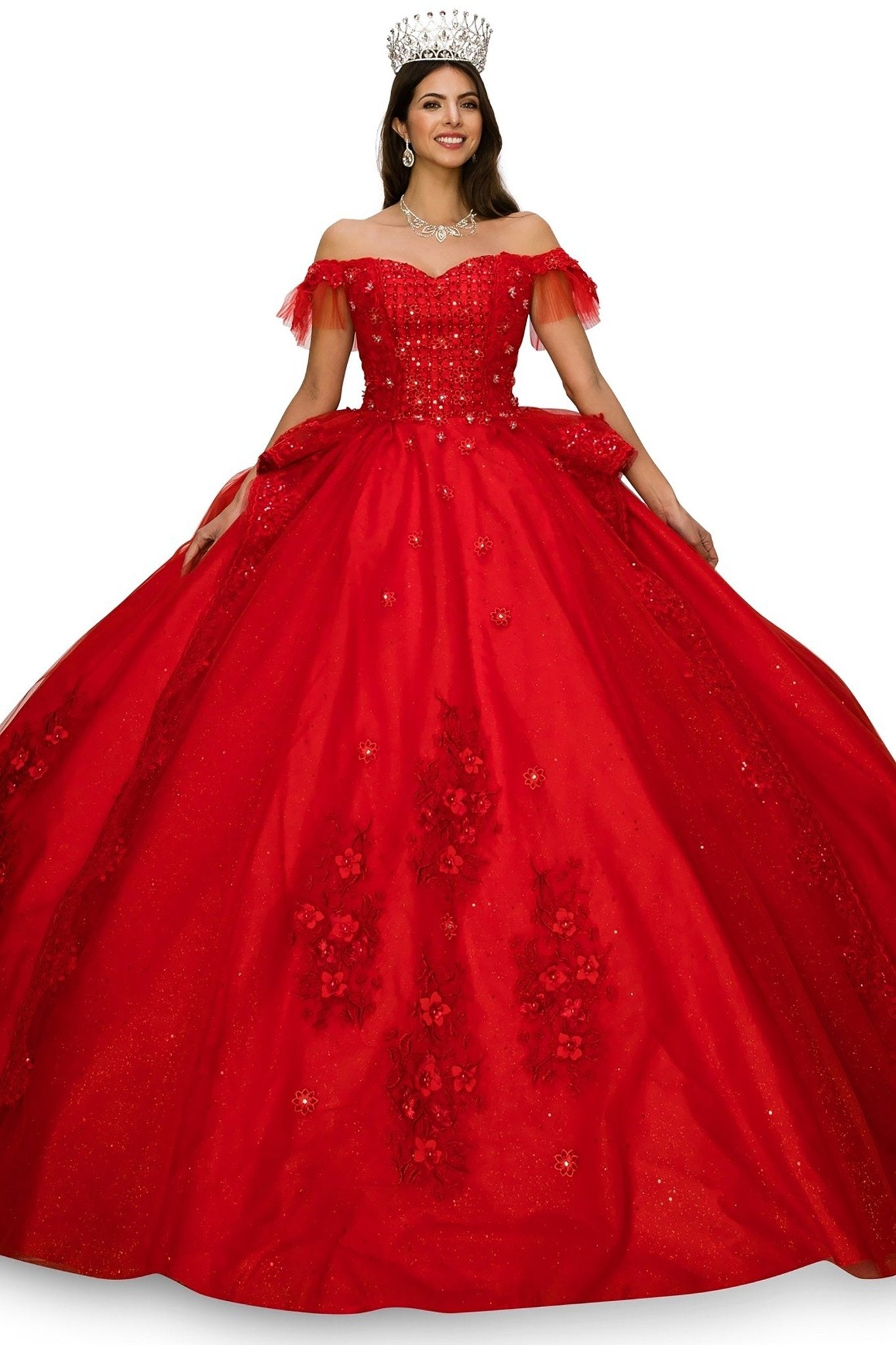 Woman wearing a red ball gown with floral embroidery and a crown on a white background