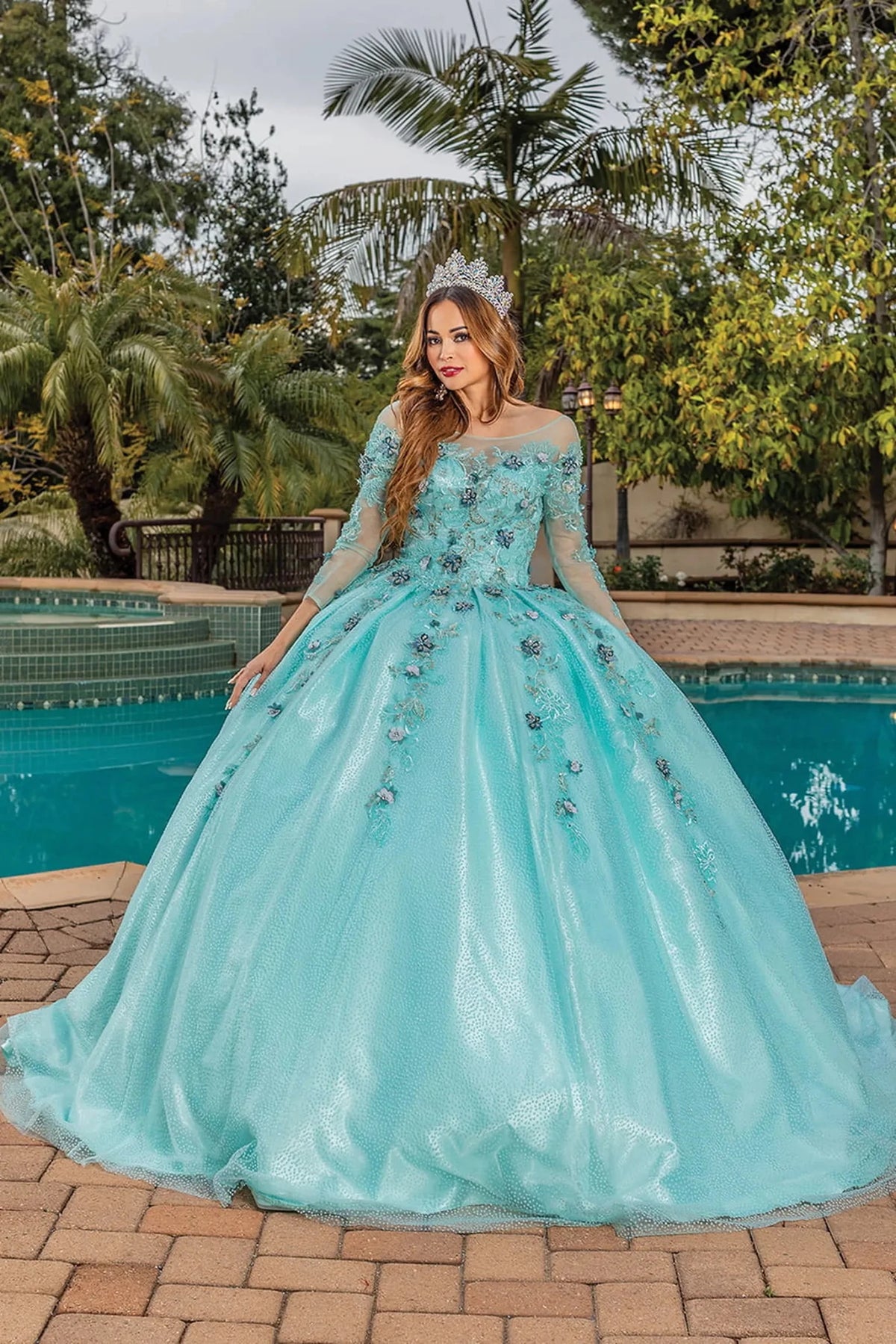 Front view of a Mint quinceañera gown with illusion neckline, beaded bodice, and floral appliqués