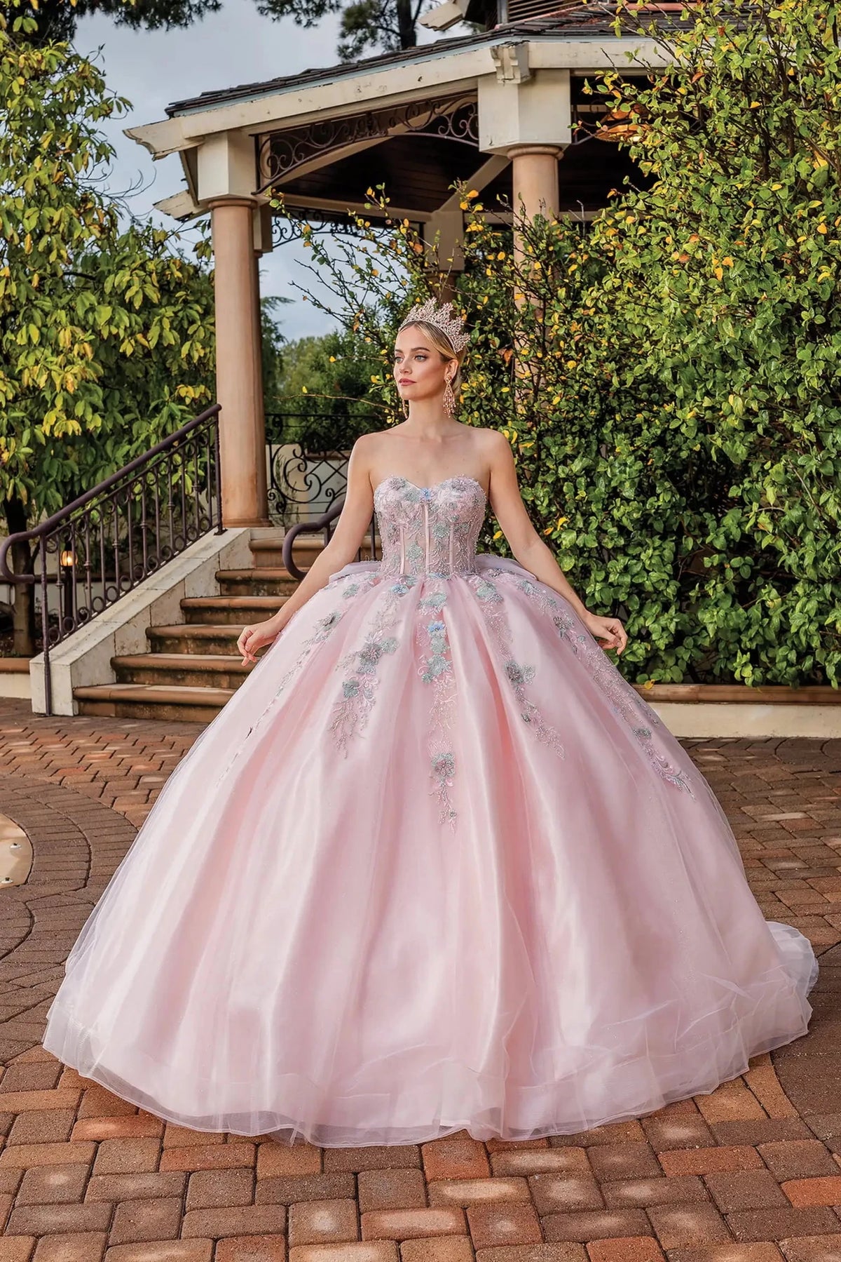 Front view of a Blush quinceañera gown with floral embroidery