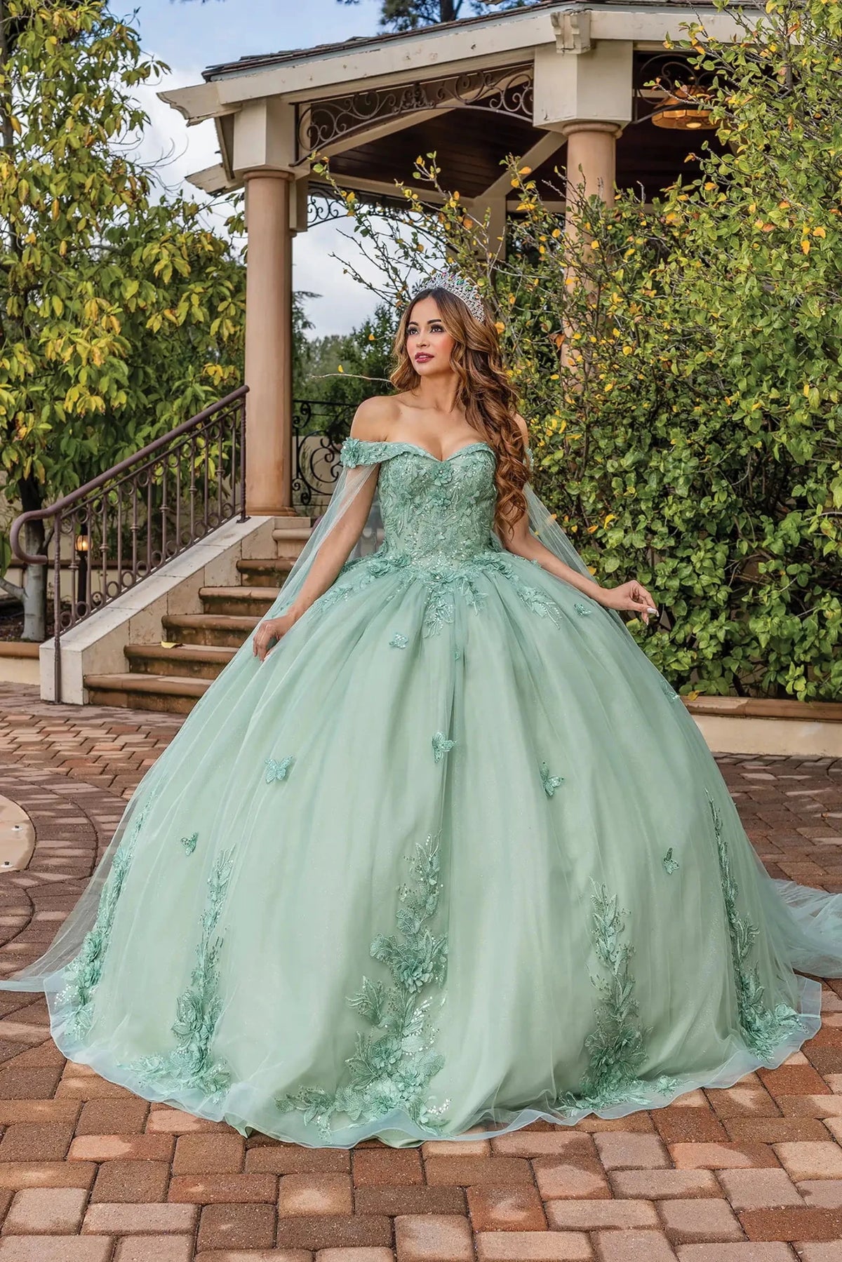 Front view of a Sage quinceañera gown with off-the-shoulder neckline and floral embroidery