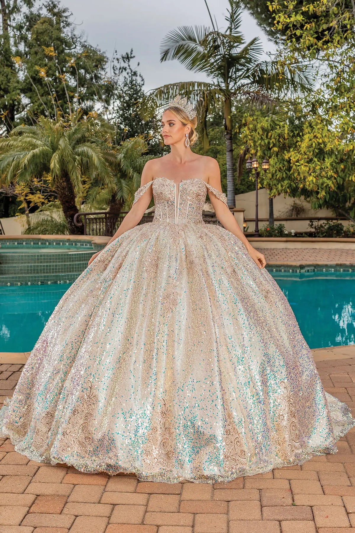 Showing iridescent sequins covering its full ball skirt, this Multi Champagne quinceañera ball gown is shown in full view.