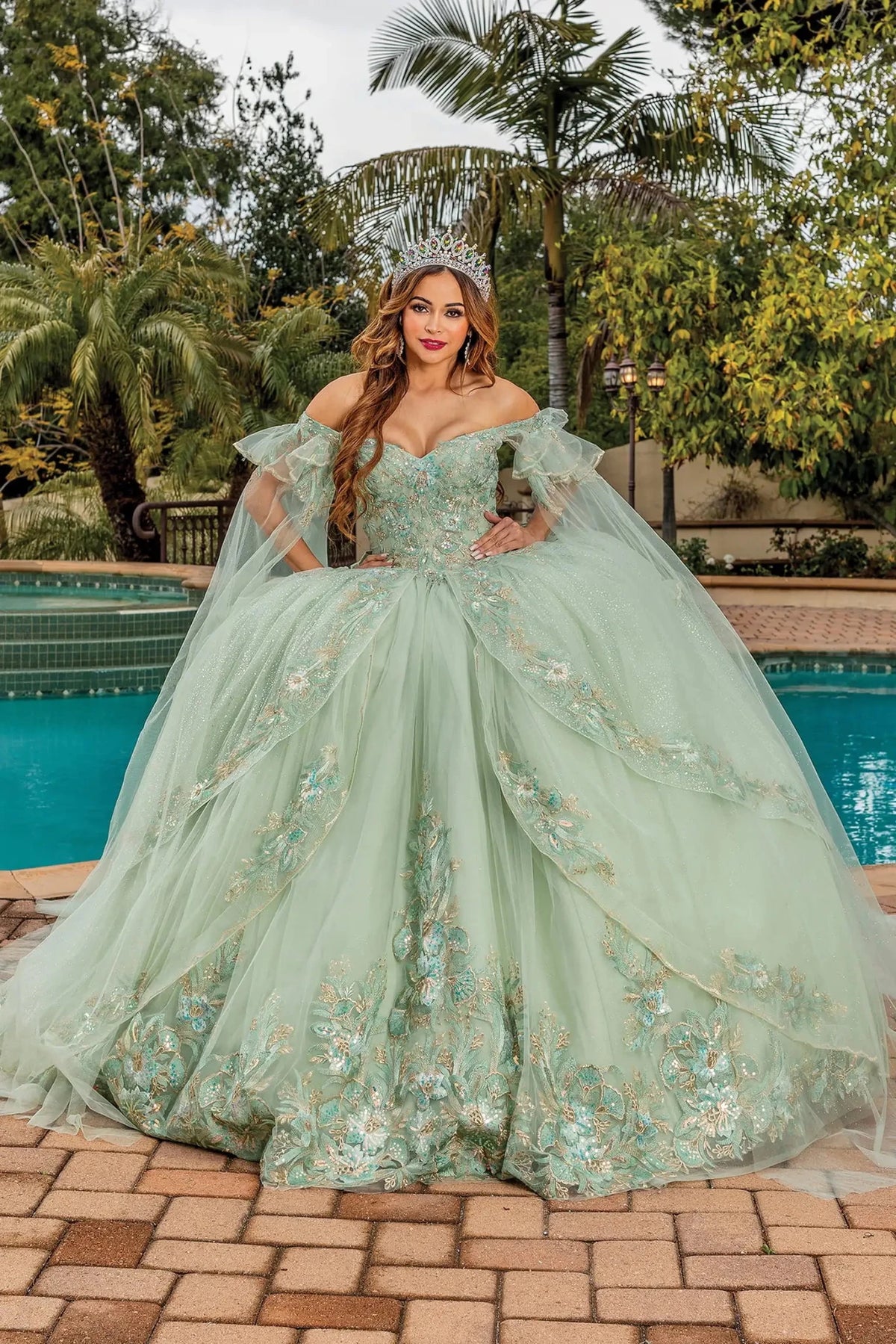 Front view of a Sage quinceañera gown with corset bodice and embroidered tulle skirt