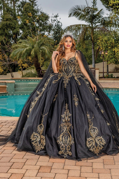 Quinceanera | Black Opulent Embroidered Gold Coiled Off-Shoulder Glittered tulle Ballgown with Dramatic Train - front view of woman wearing dress