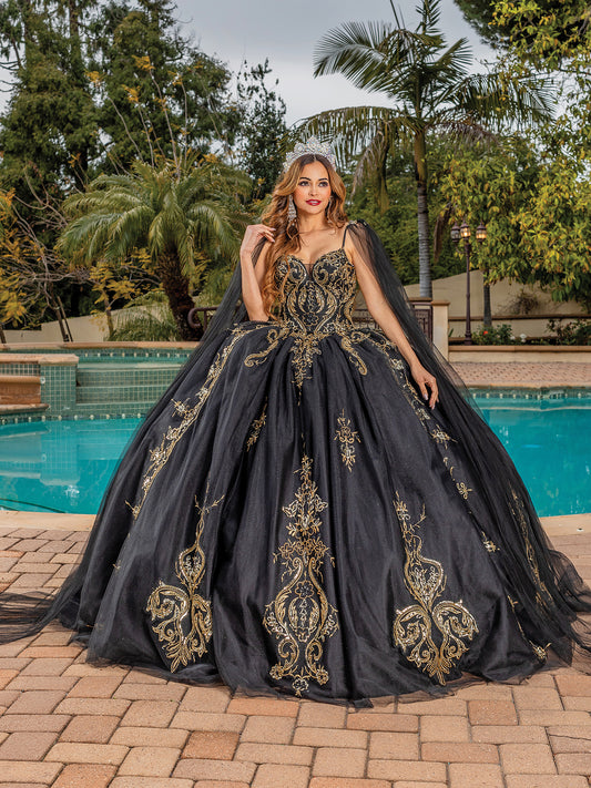 Quinceanera | Black Opulent Embroidered Gold Coiled Off-Shoulder Glittered tulle Ballgown with Dramatic Train - front view of woman wearing dress