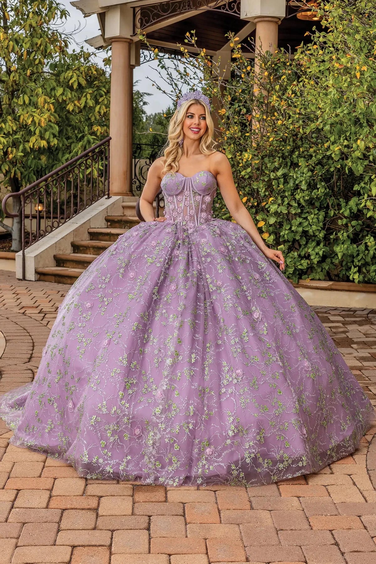 Front view of a Dusty Lilac quinceañera gown with embroidered lace and full tulle skirt
