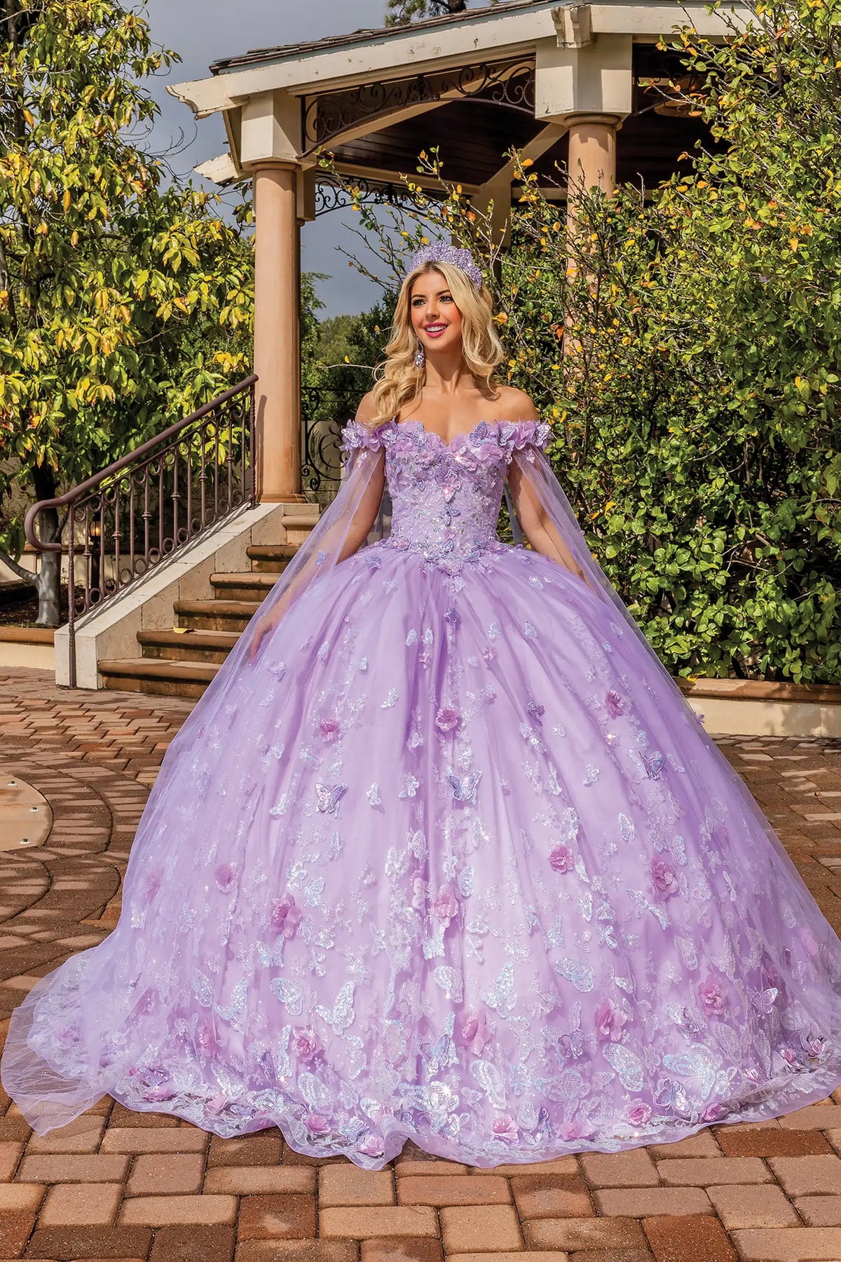 Front portrait of a Lilac quinceañera gown with off-the-shoulder neckline and floral appliqués