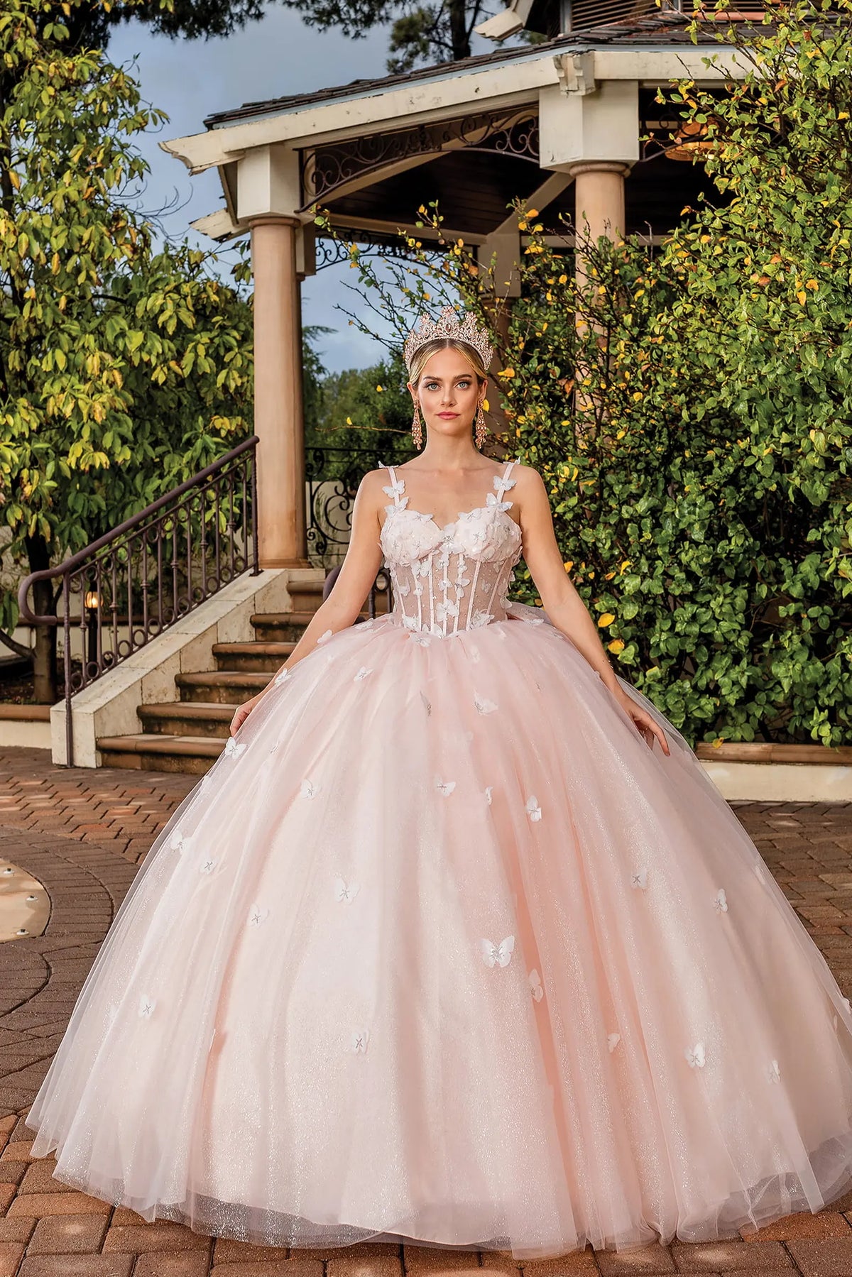Alternate full-length front view of a Blush quinceañera gown highlighting voluminous full skirt and floral appliqués