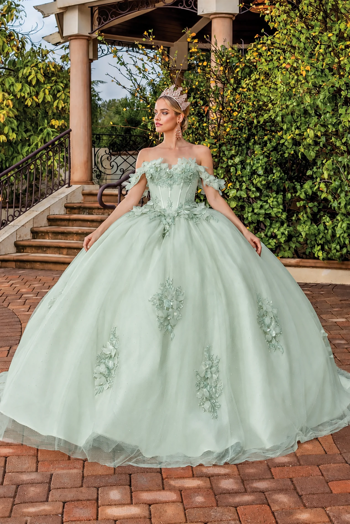 Front view of a Sage quinceañera gown with off-the-shoulder neckline and floral appliqués