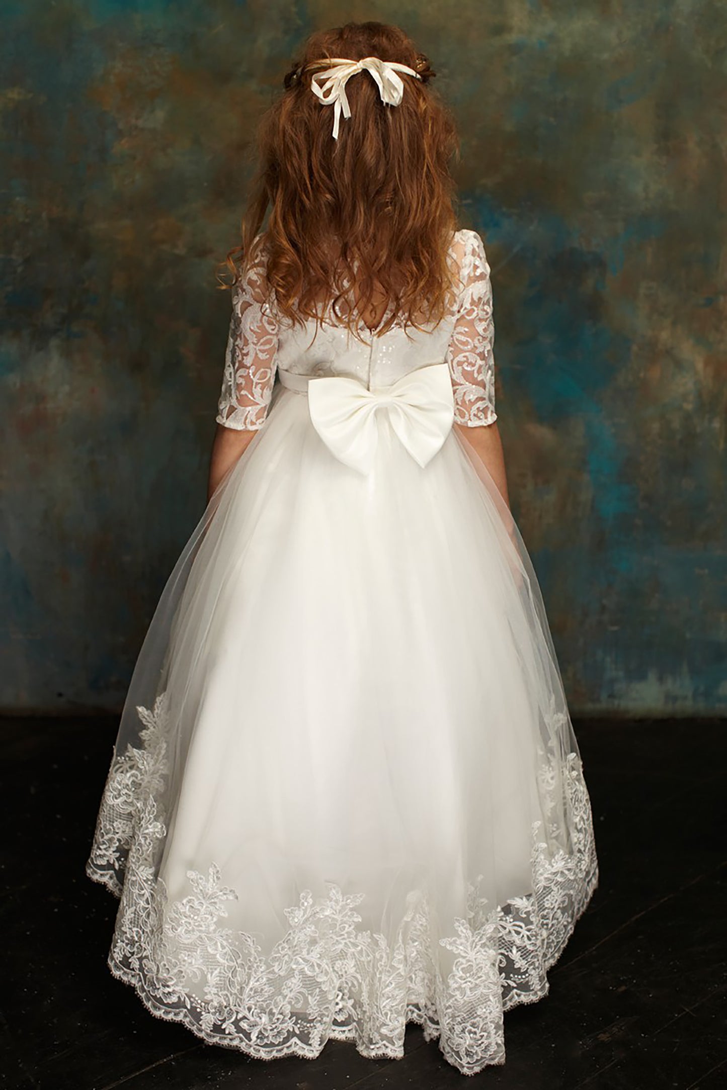 White High-Low Tulle Dress with Embroidered Top | First Communion | Flower Girl - back view of girl wearing dress with bow