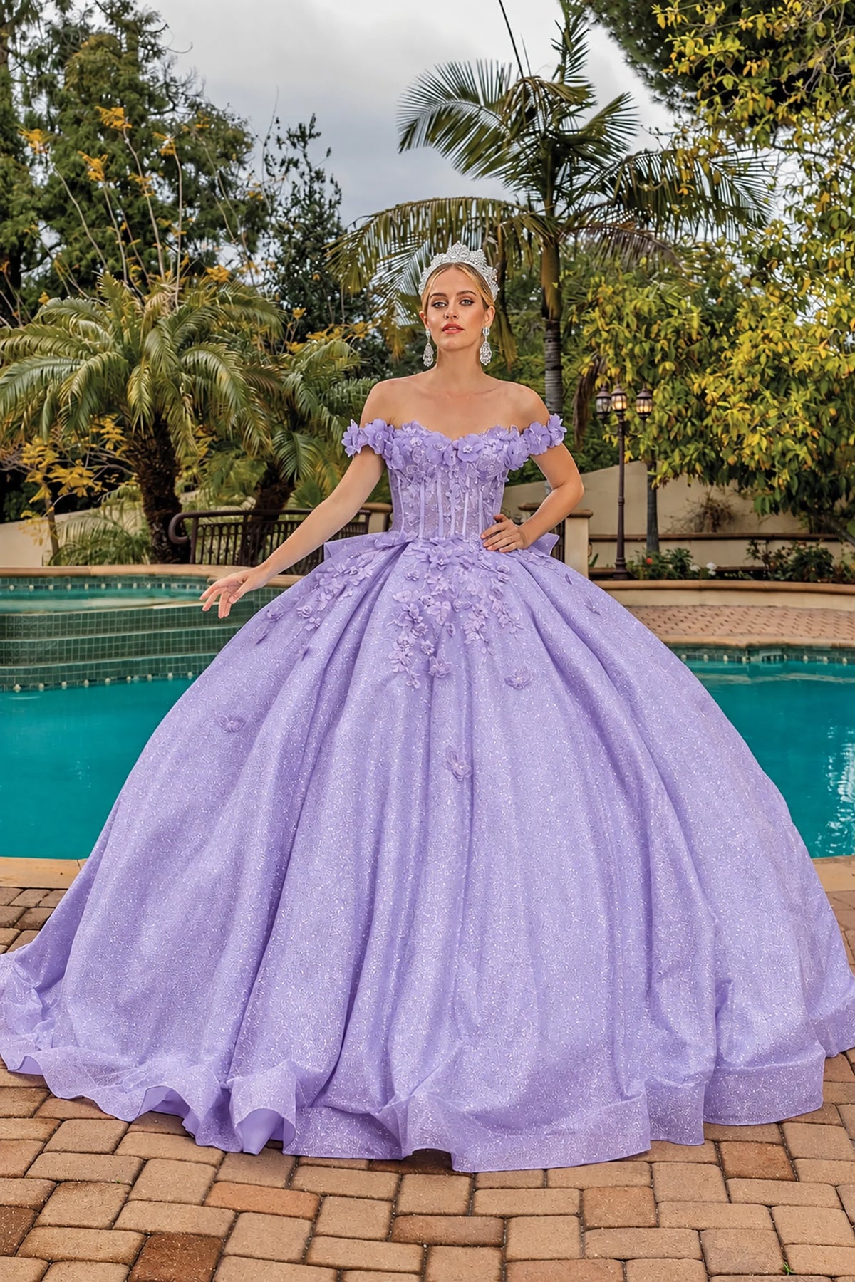 Front view of a Lilac quinceañera gown with off-the-shoulder neckline and floral appliqués