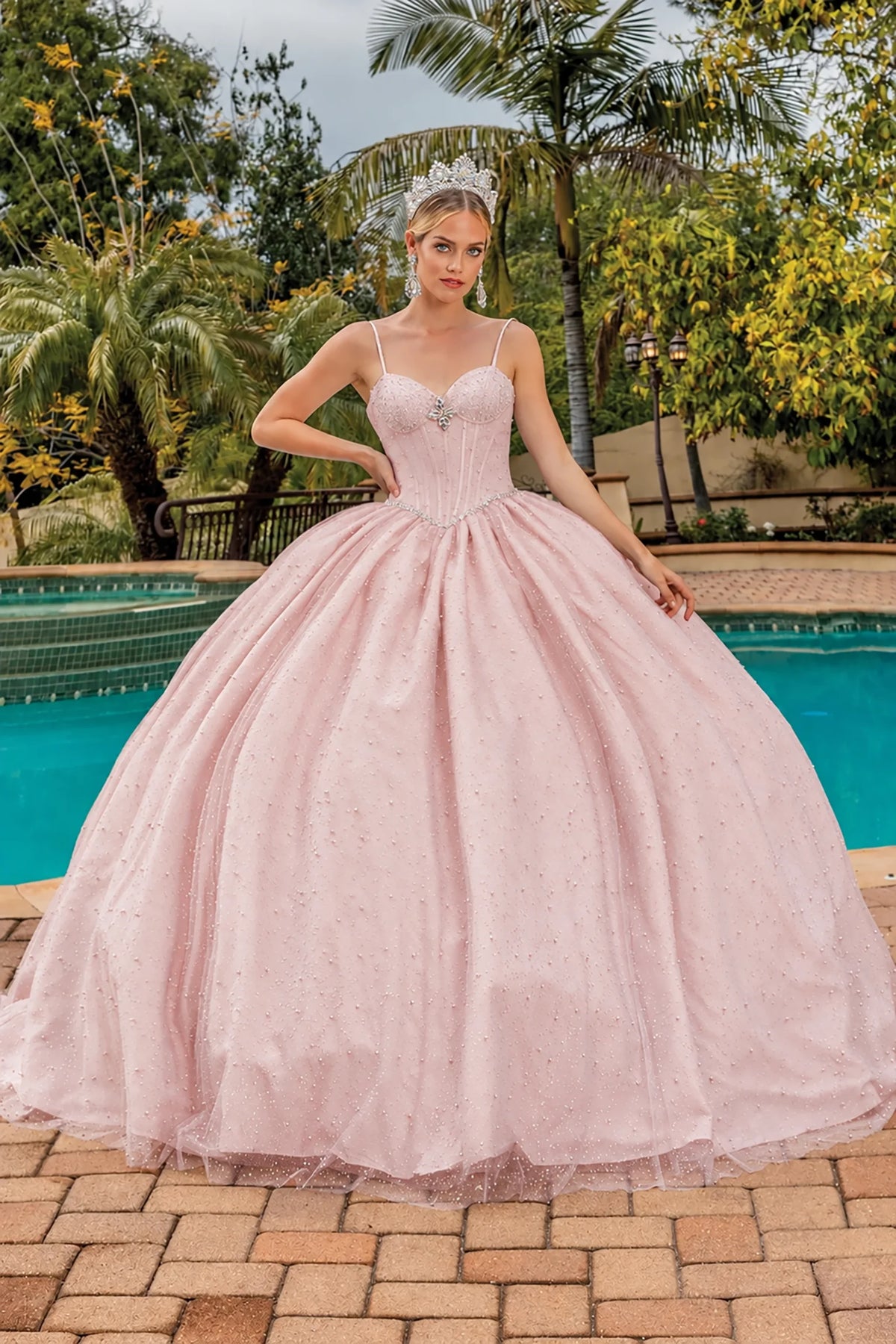 Front view of a Blush quinceañera gown with sweetheart neckline and glitter tulle skirt