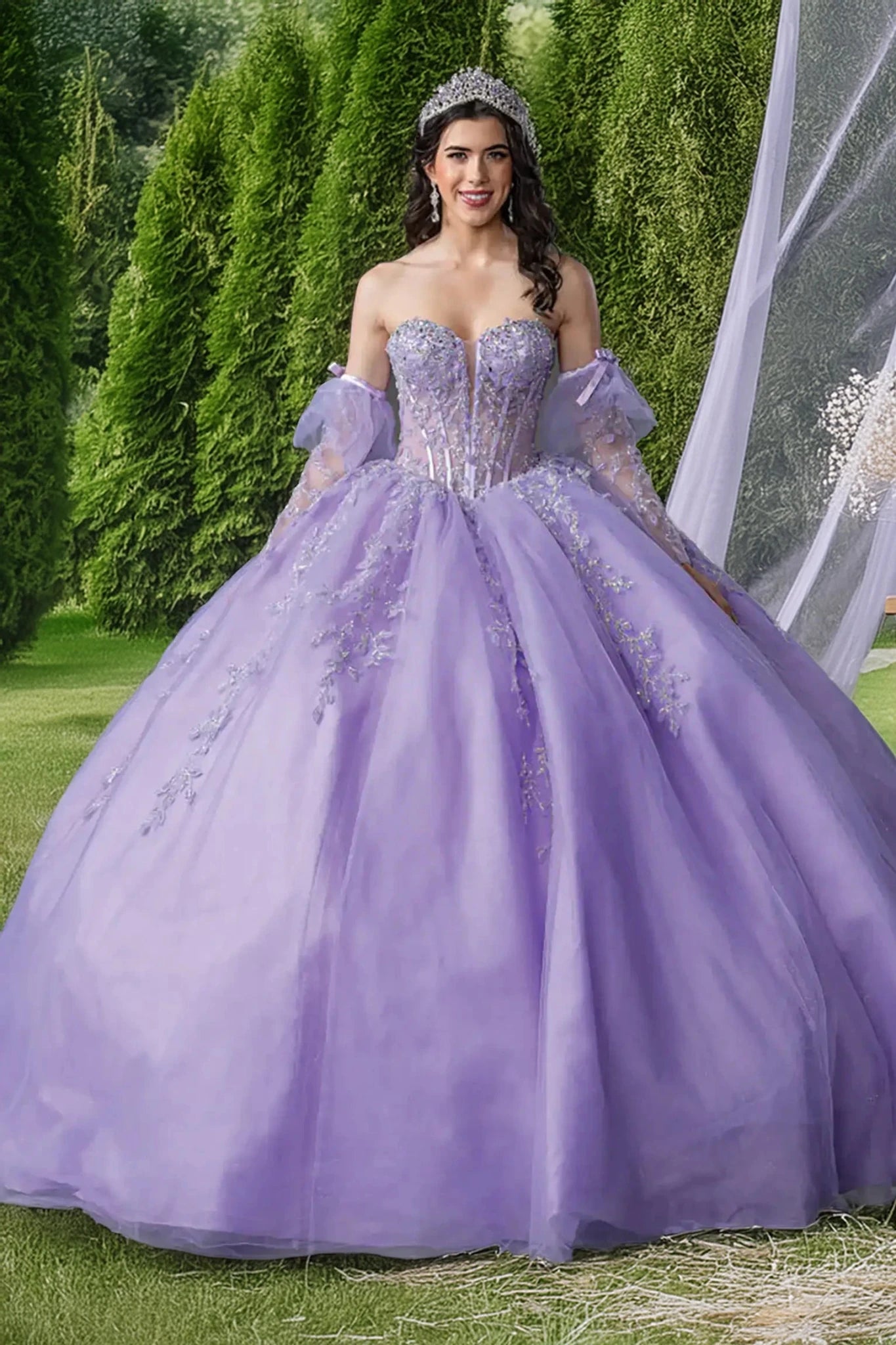 Woman in a lilac quinceball gown with floral details and long lace sleeves.