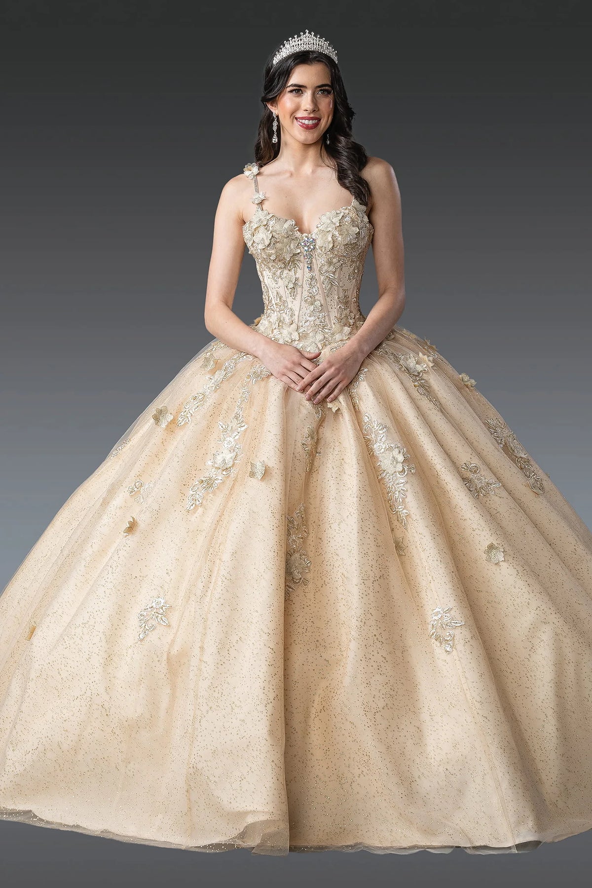 Front view of a Champagne quinceañera gown with sweetheart neckline, beaded bodice, and voluminous full skirt