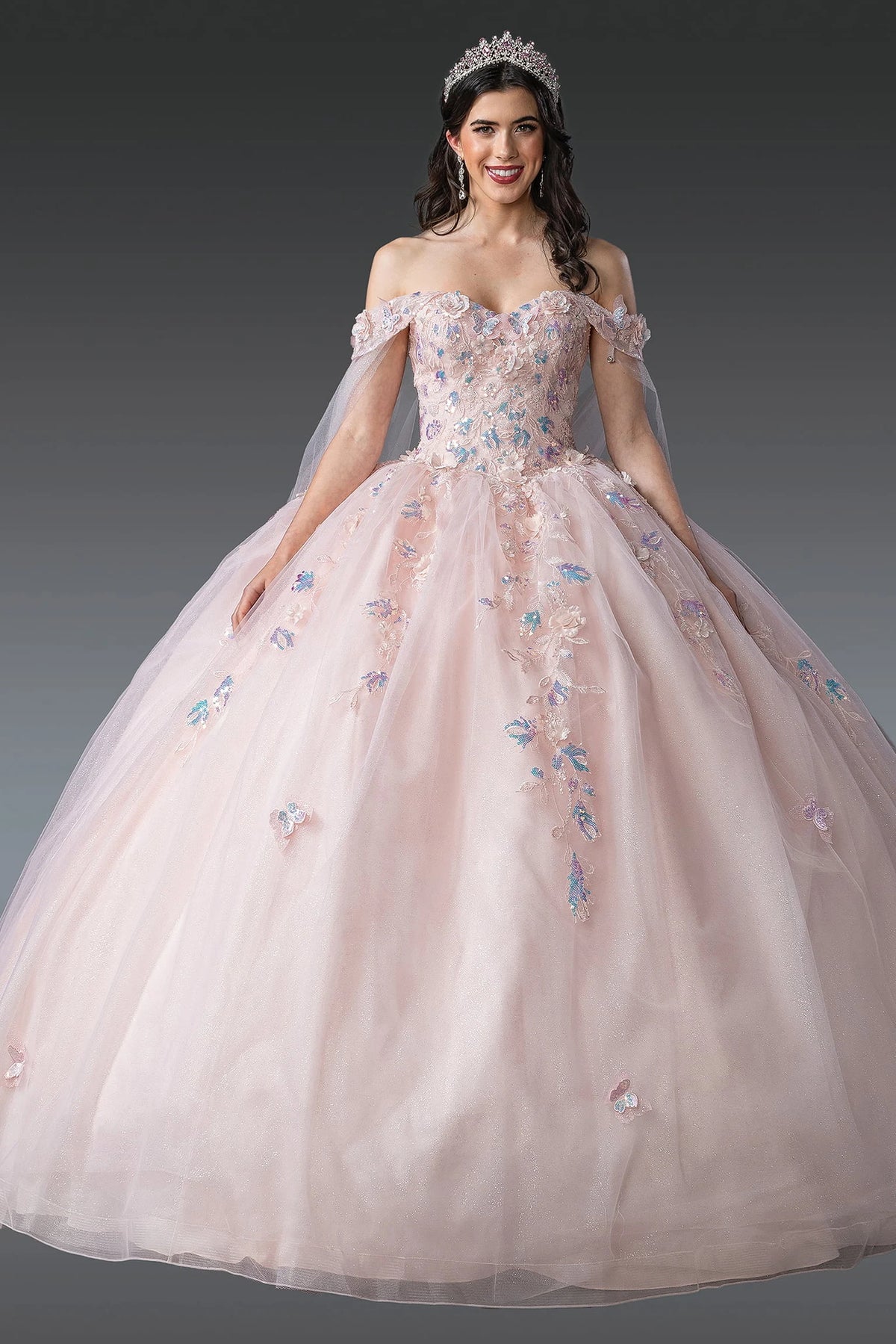 Front view of a Blush quinceañera gown with off-the-shoulder neckline and voluminous full skirt
