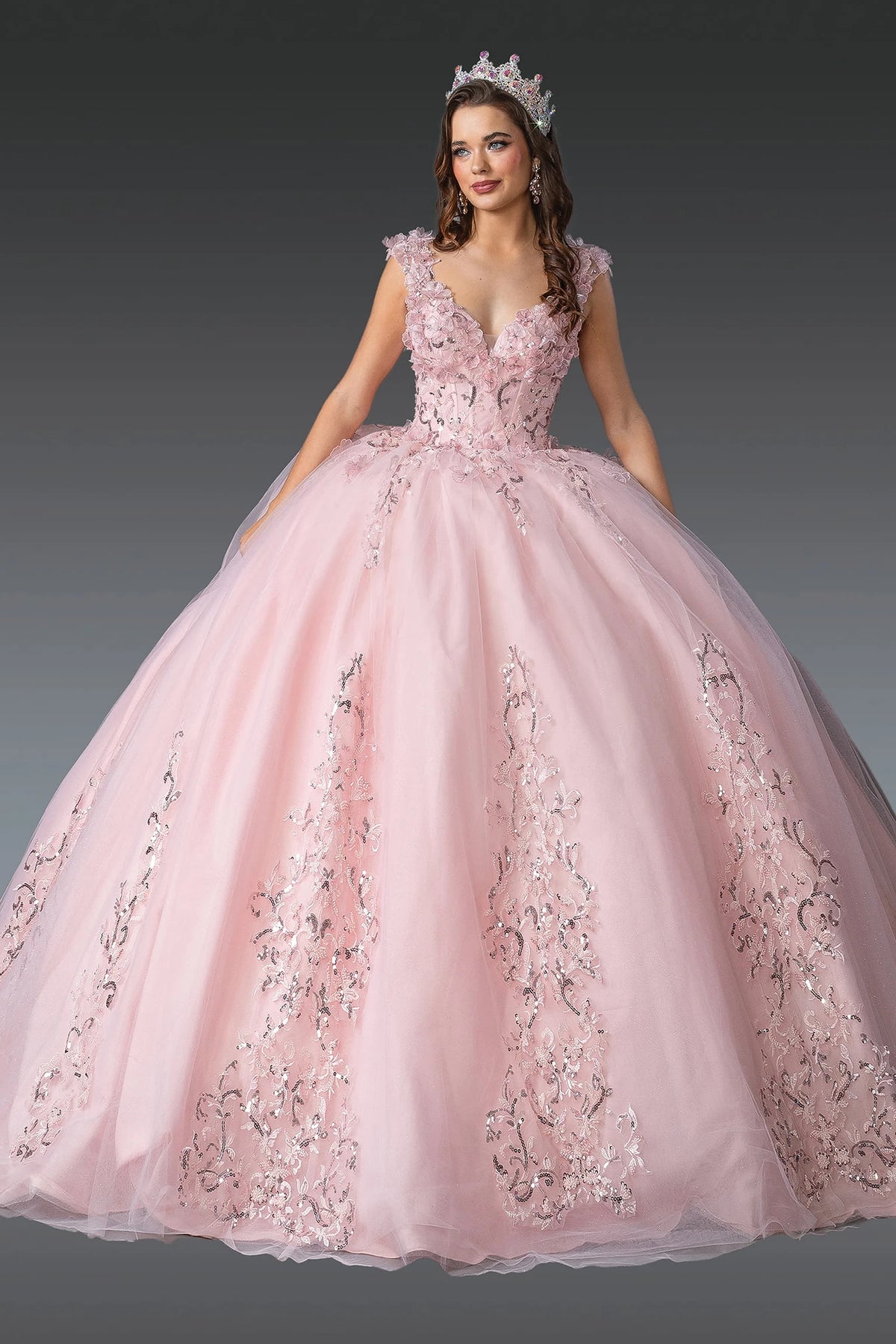 Front view of a Blush quinceañera gown with V-neckline, embroidered lace, and voluminous full skirt