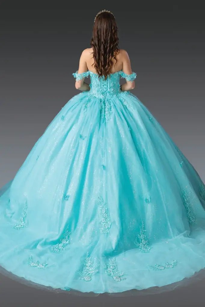 Back view of aqua quinceañera ball gown showcasing lace-up corset back, off-shoulder straps, embroidered tulle skirt, and full ball gown silhouette photographed in studio lighting