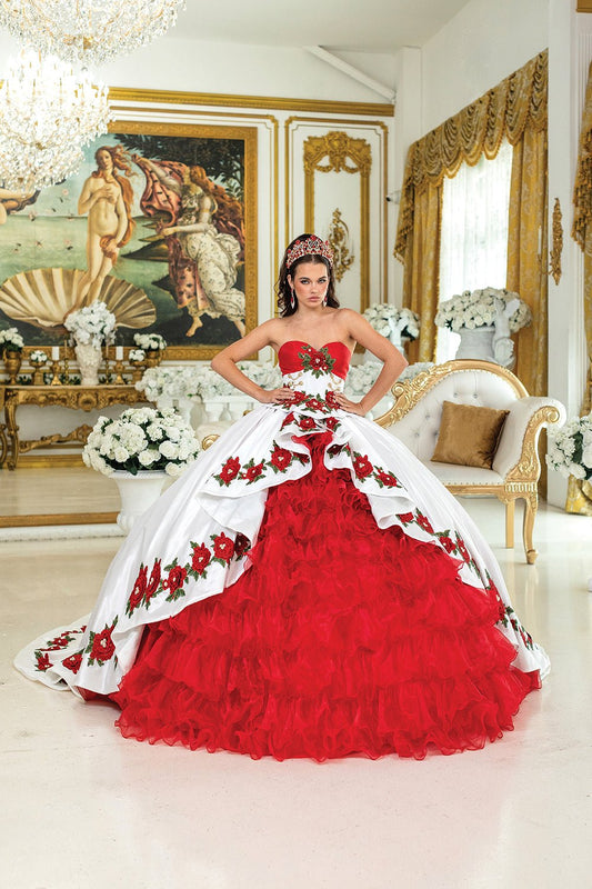 Woman standing front-facing in white and red strapless quinceañera ball gown with embroidered floral bodice, layered ruffled skirt, and butterfly accents