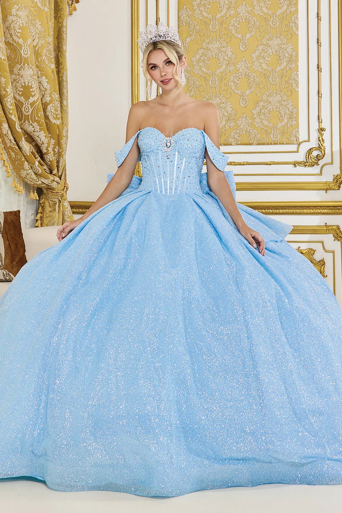 Showing a structured sweetheart bodice and glitter tulle skirt, this Bahama Blue quinceañera ball gown is shown in full view.