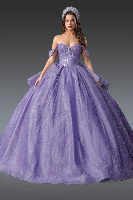 Showing a structured sweetheart bodice and glitter tulle skirt, this Lilac quinceañera ball gown is shown in full view.