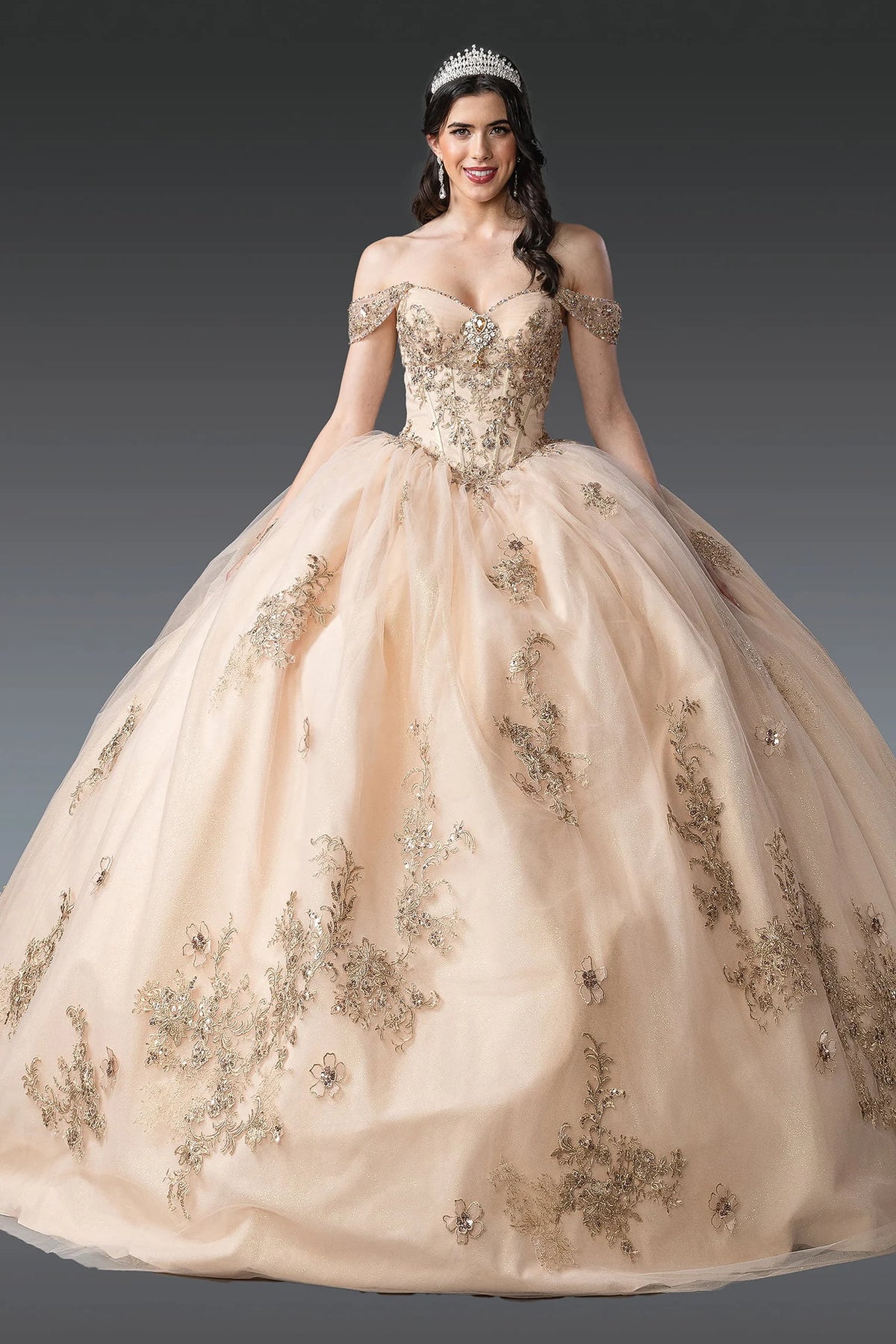 Front view of a Champagne quinceañera gown with off-the-shoulder neckline, beaded bodice, floral appliqués, and full tulle skirt