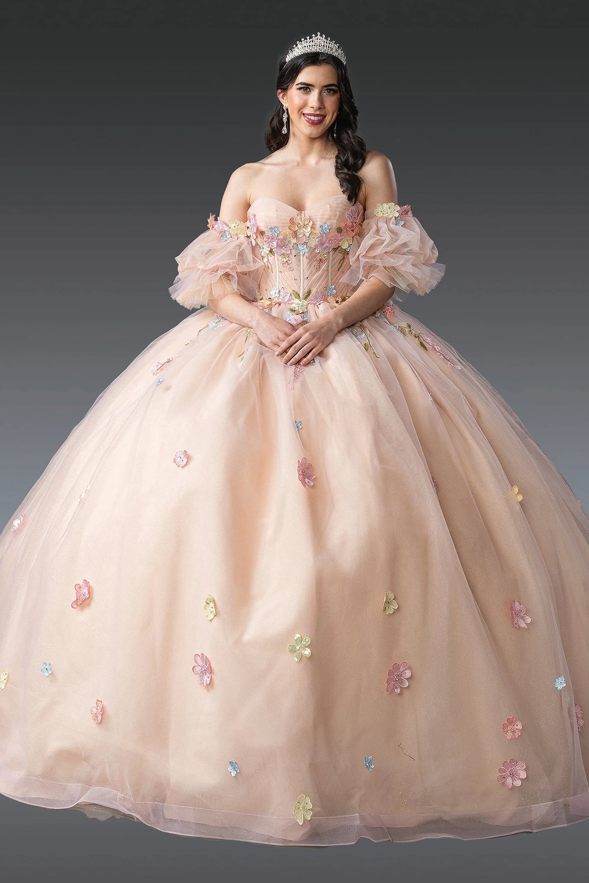 Front view of a Champagne quinceañera gown with off-the-shoulder neckline, puff sleeves, and floral appliqués