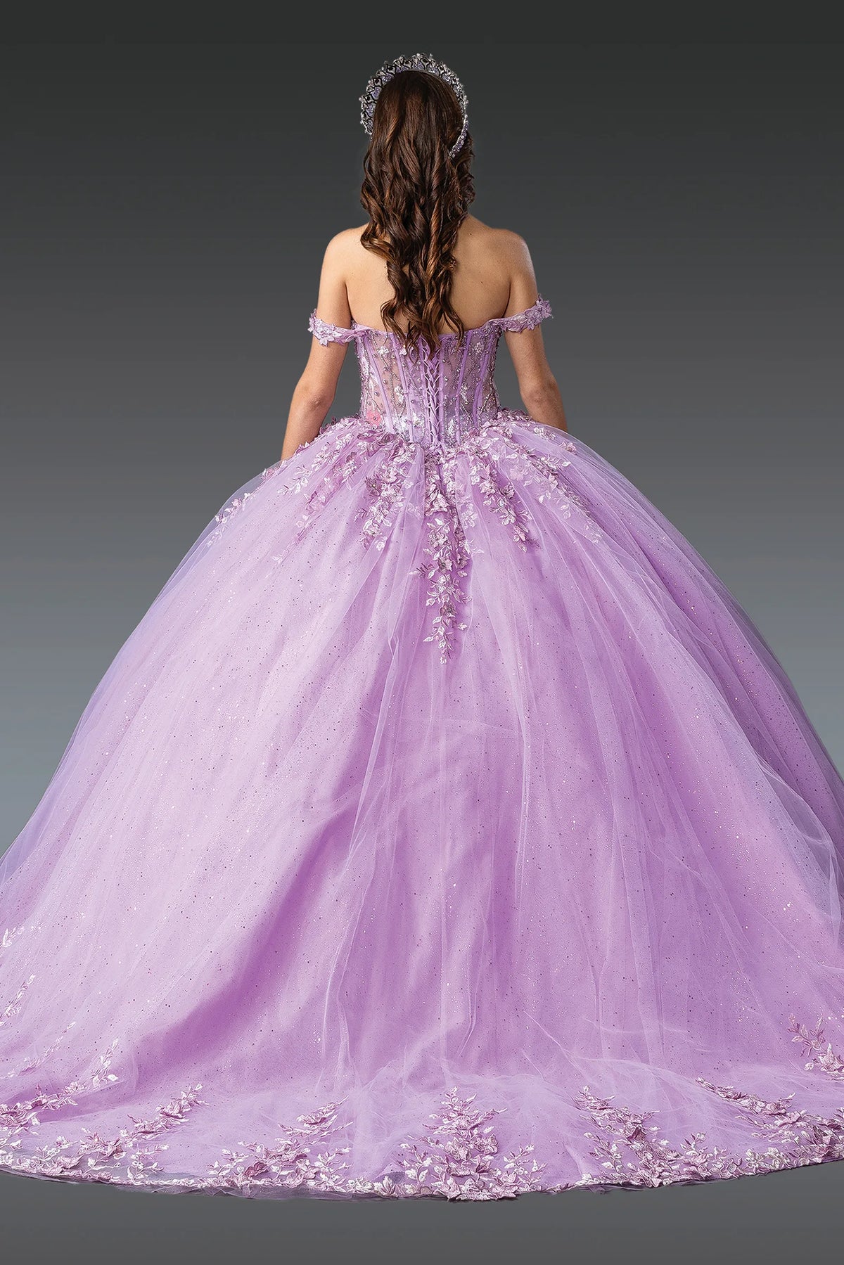 Full-skirt back view of a Lilac quinceañera gown showing lace-up back and floral appliqués