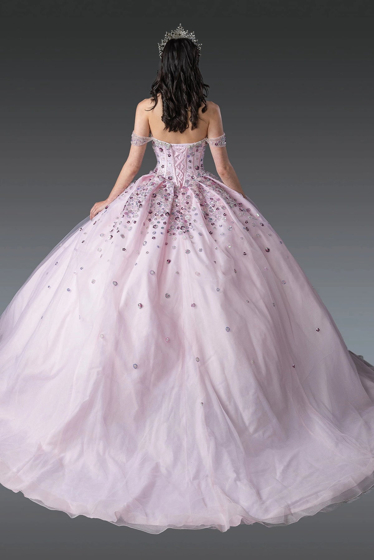 Rear view of a Blush quinceañera gown showing lace-up back and crystal accents