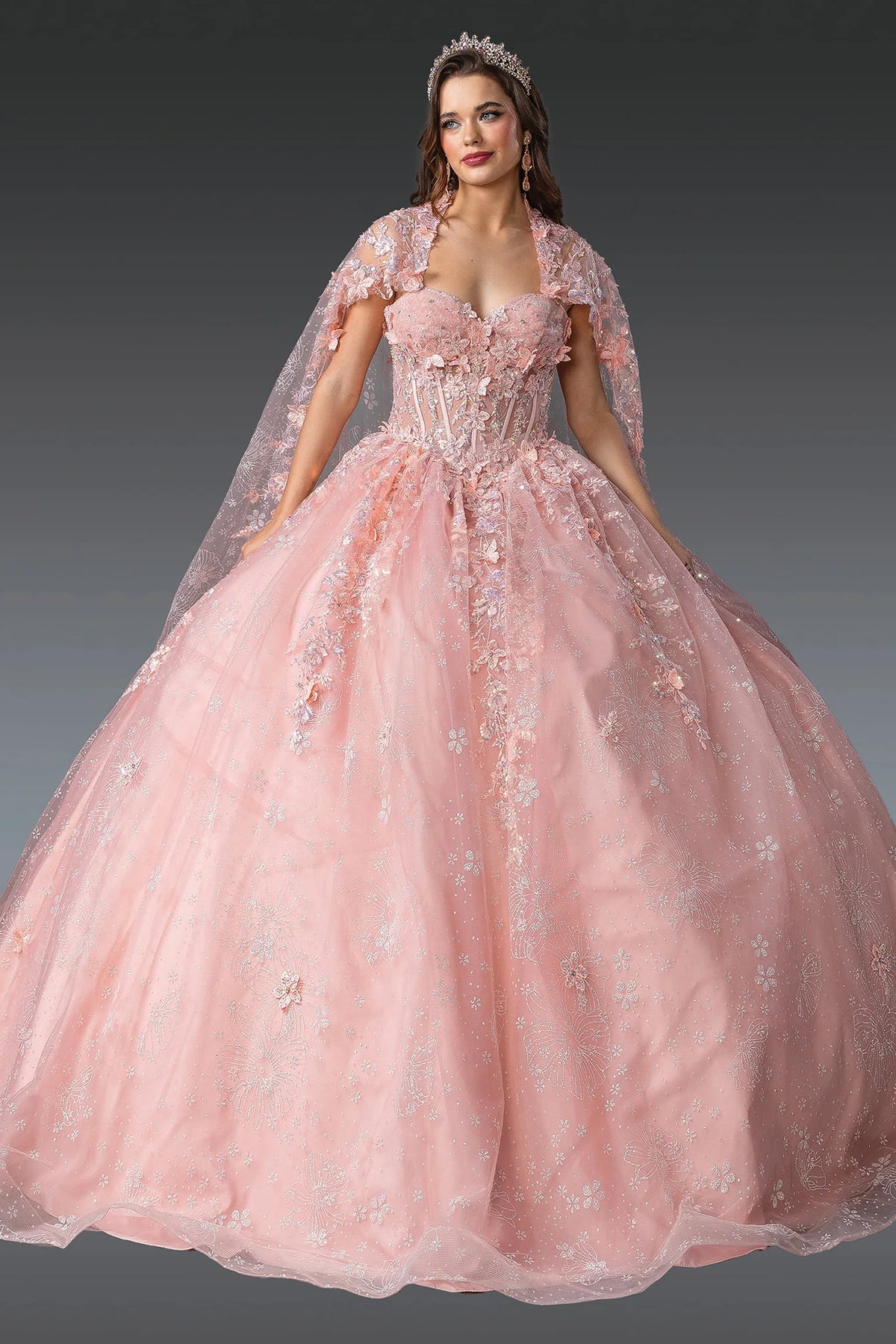 Additional full-length view of a Blush quinceañera gown highlighting floral embroidery and sheer cape