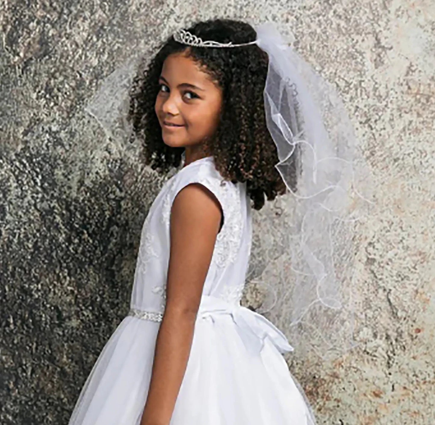 White rhinestone flower girl and first communion tiara and two-tier veil.