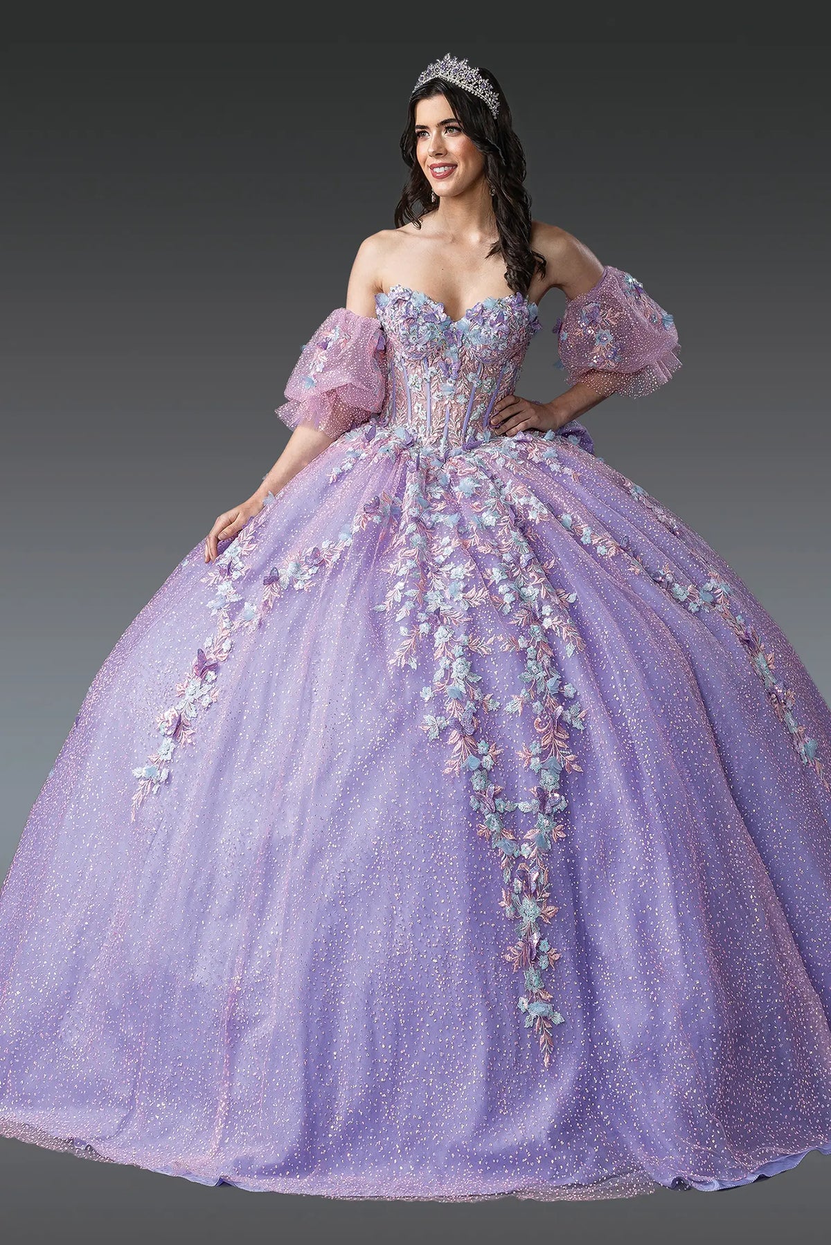 Front view of a Lilac/Multi Print quinceañera gown with off-the-shoulder neckline, puff sleeves, beaded bodice, and floral embroidery