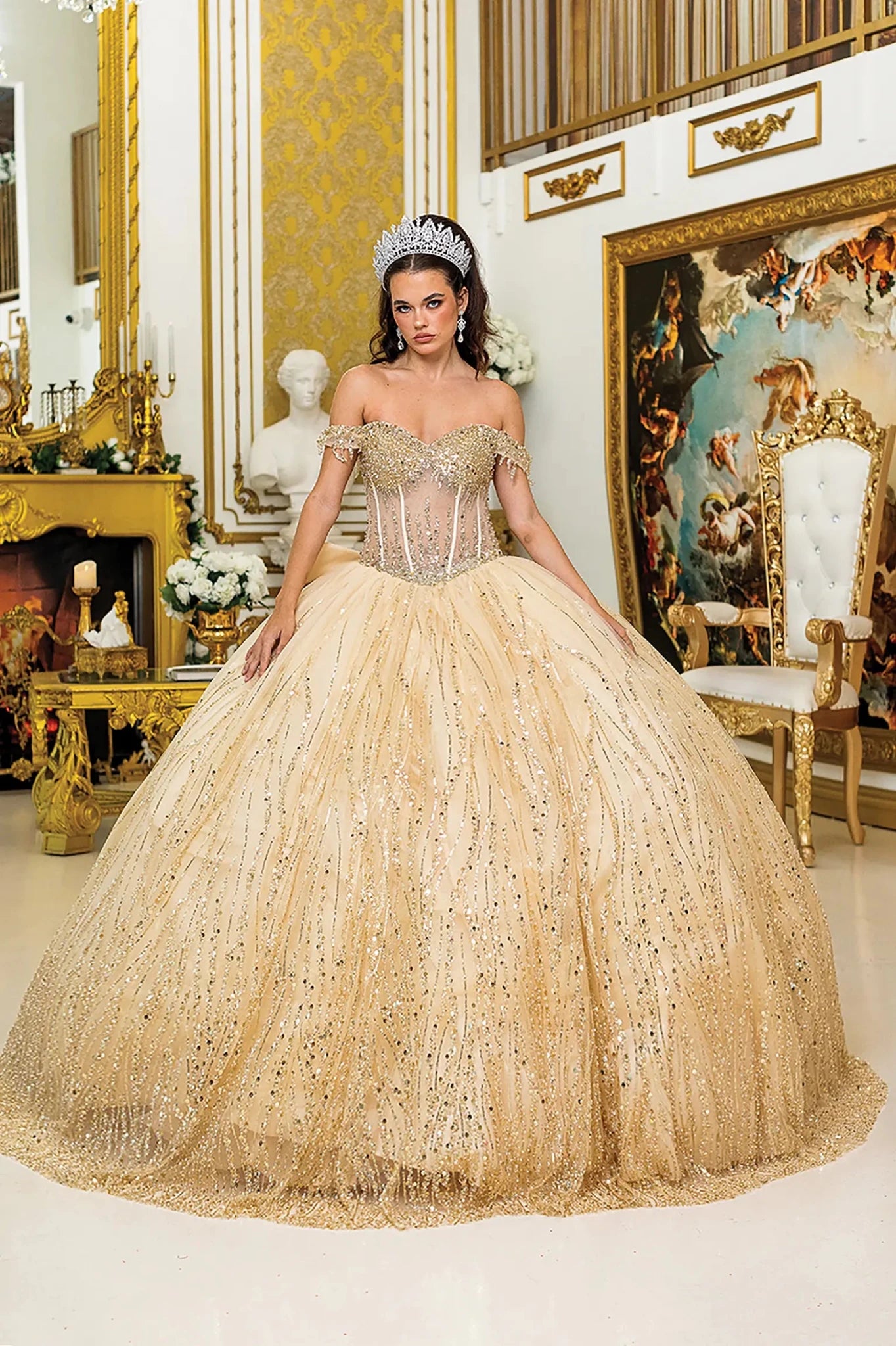 Woman standing front-facing in Champagne ball gown skirt fabric with sequined overlay, layered tulle, and sparkling embellishments from quinceañera dress