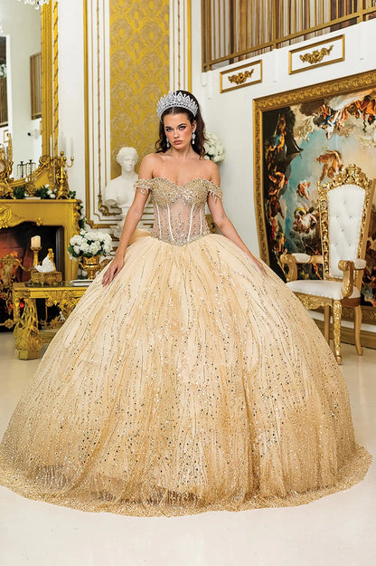 Woman standing front-facing in Champagne ball gown skirt fabric with sequined overlay, layered tulle, and sparkling embellishments from quinceañera dress