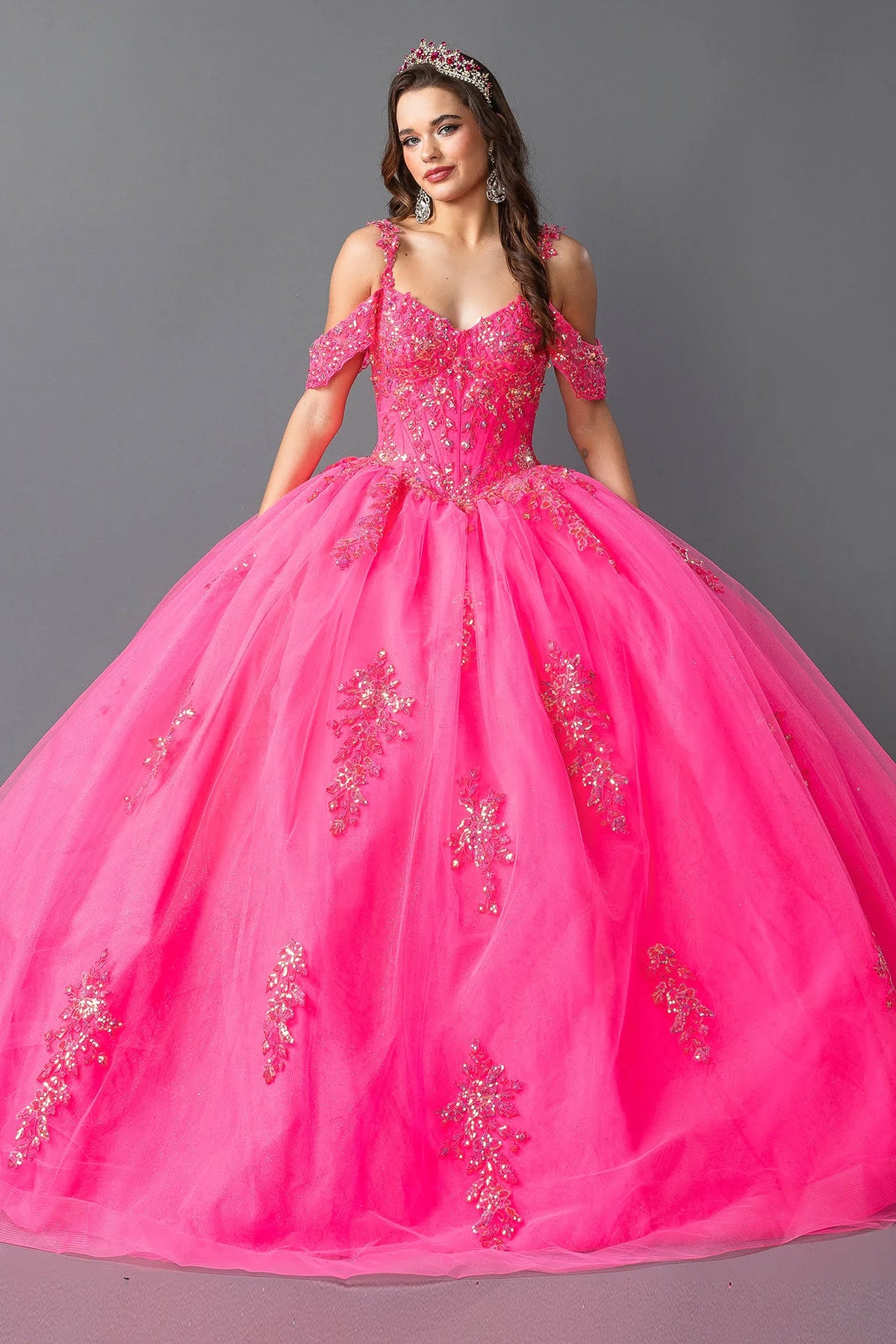 Front view of a Hot Pink quinceañera gown with embellished bodice