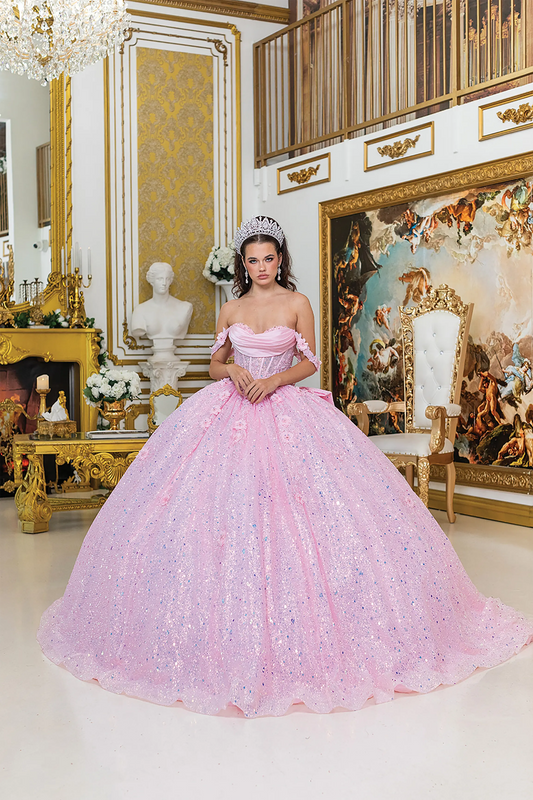 Front view of a woman wearing pink quinceañera dress featuring off-shoulder neckline, ruched bodice, 3D floral appliqué, and glitter tulle skirt