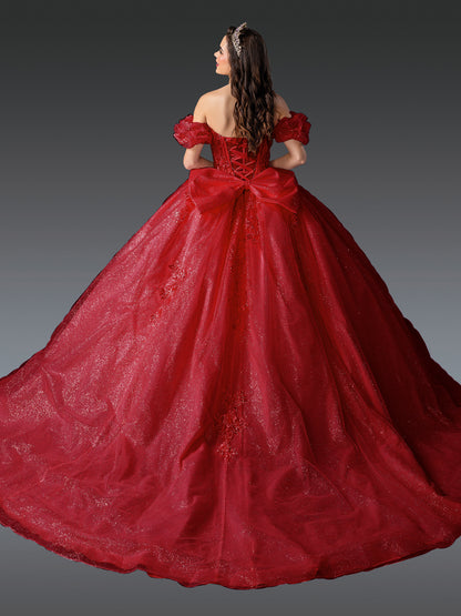 Woman standing back-facing in red quinceañera ball gown with off-shoulder sleeves, lace-up embroidered bodice, and flowing layered skirt with train