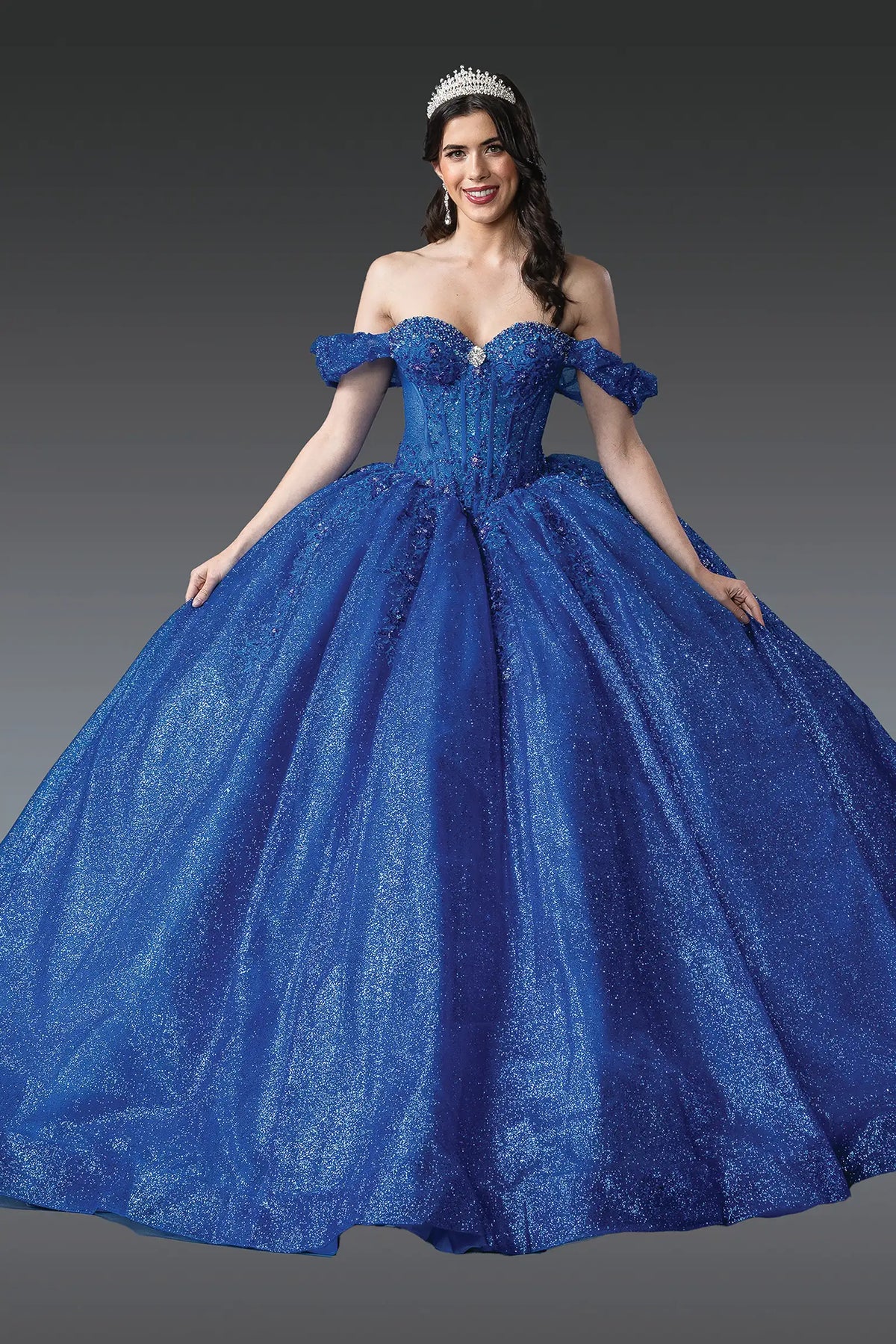 Front view of a Royal Blue quinceañera gown with off-the-shoulder neckline, beaded corset bodice, and glitter tulle skirt