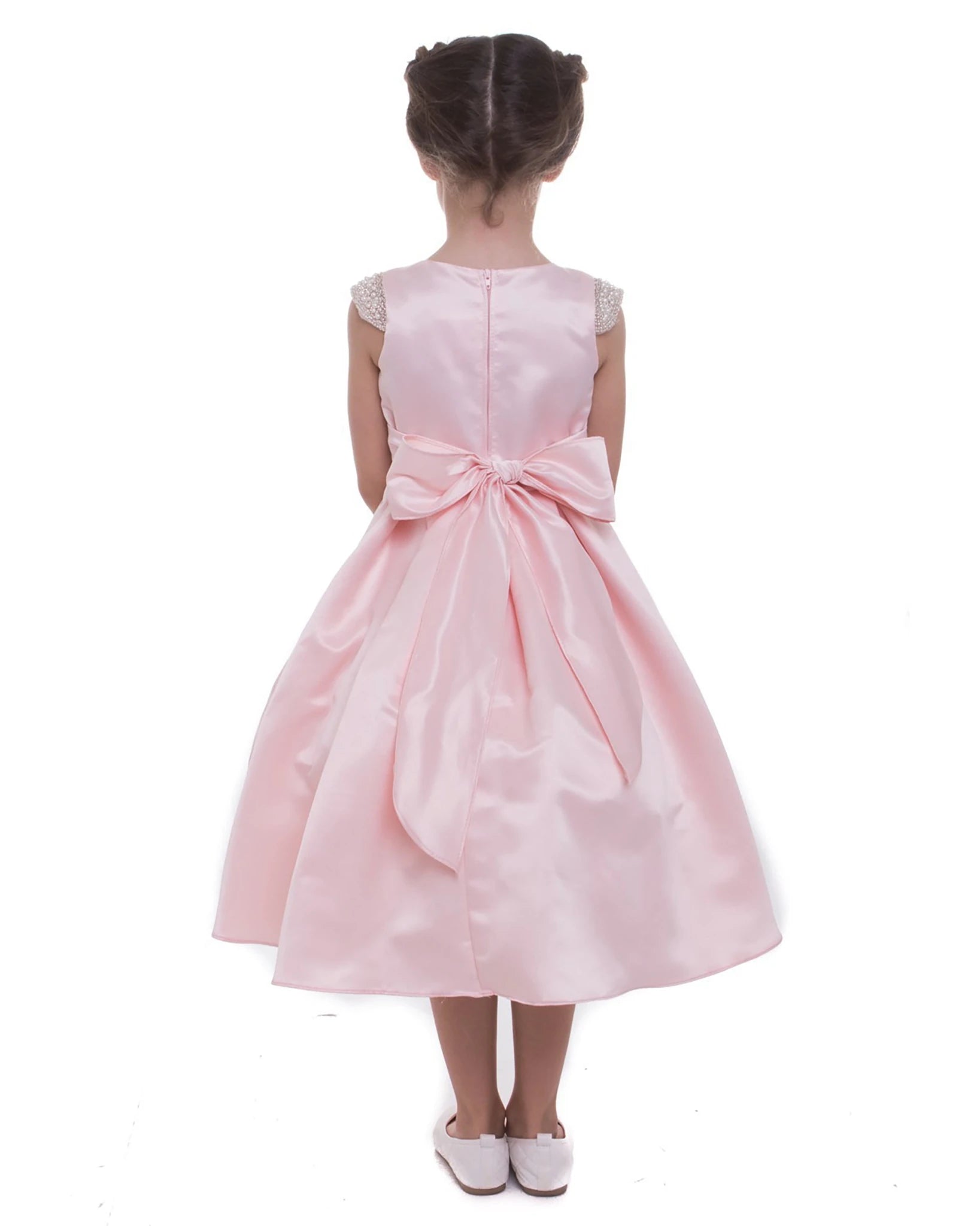 Pink flower girl dress with a bow.