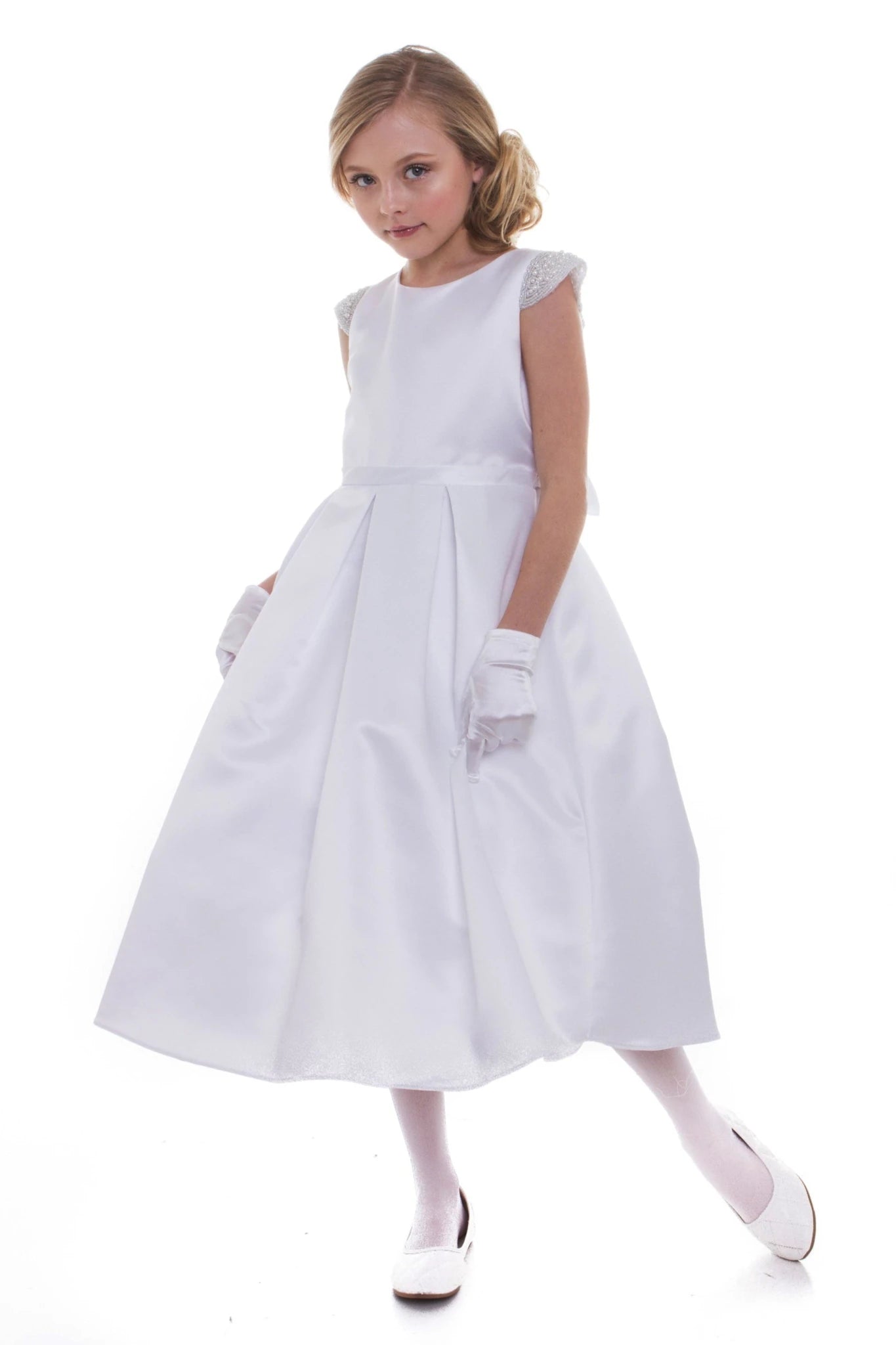 A white flower girl dress with pearl puff sleeves. Also suitable as a communion dress. Also suitable as a baptism dress.